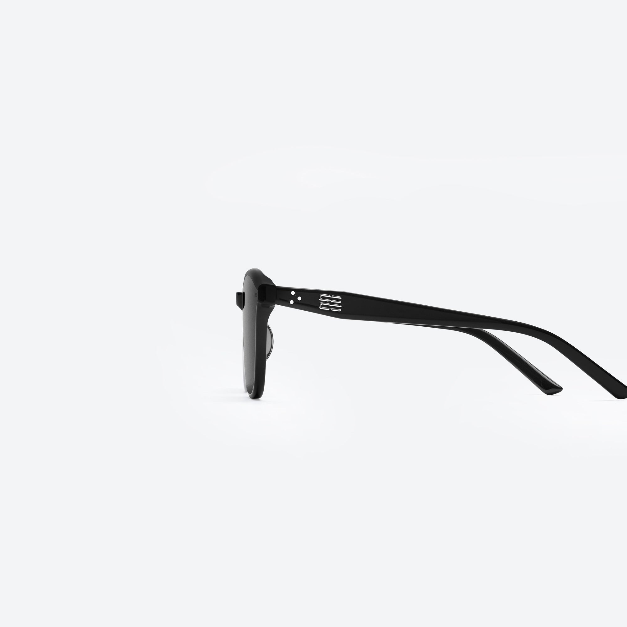 A detailed left view of Gentle Monster Jude 01 Black Acetate framed Round sunglasses.