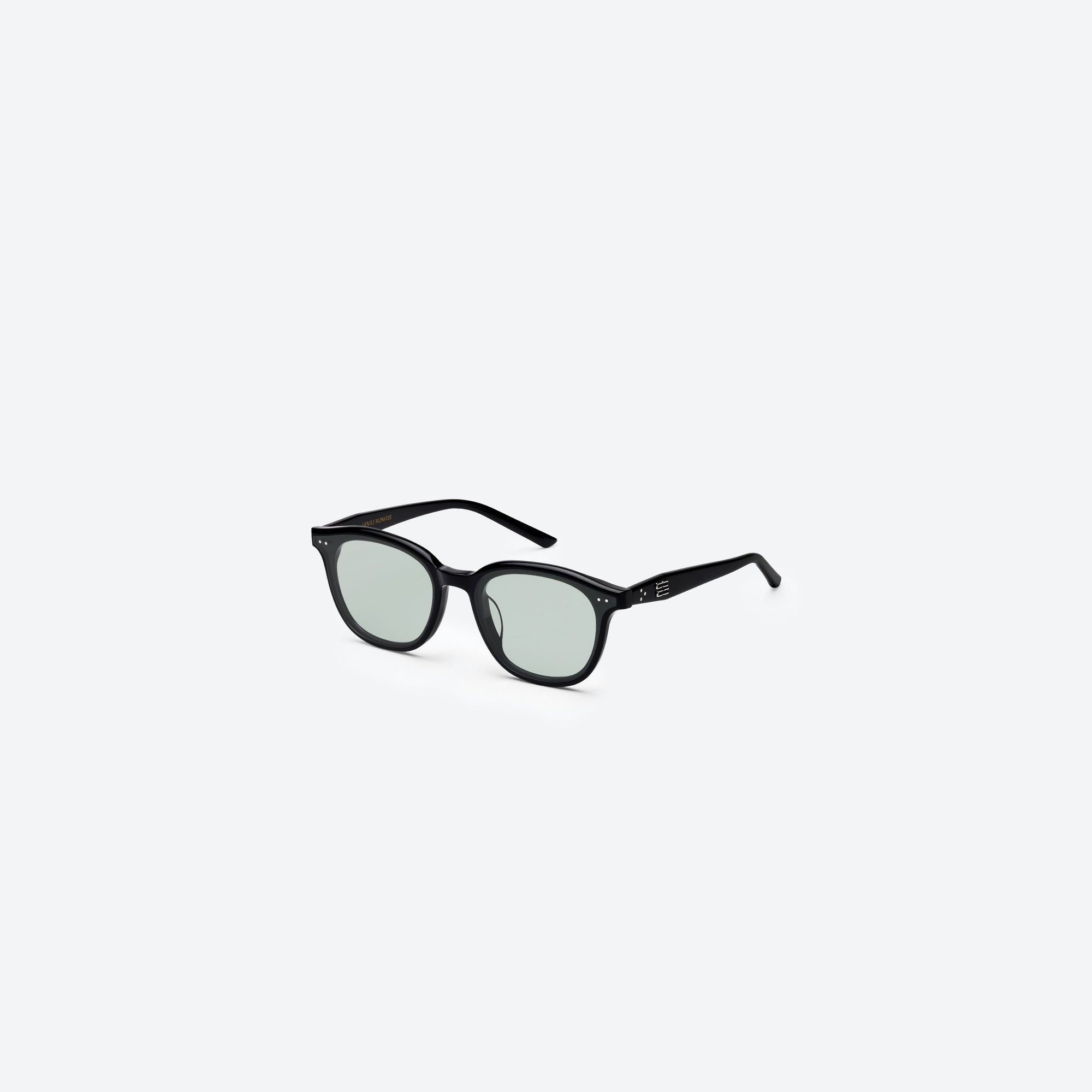 45-degree view of Gentle Monster Jude 01(GR) Black Acetate framed Round sunglasses.