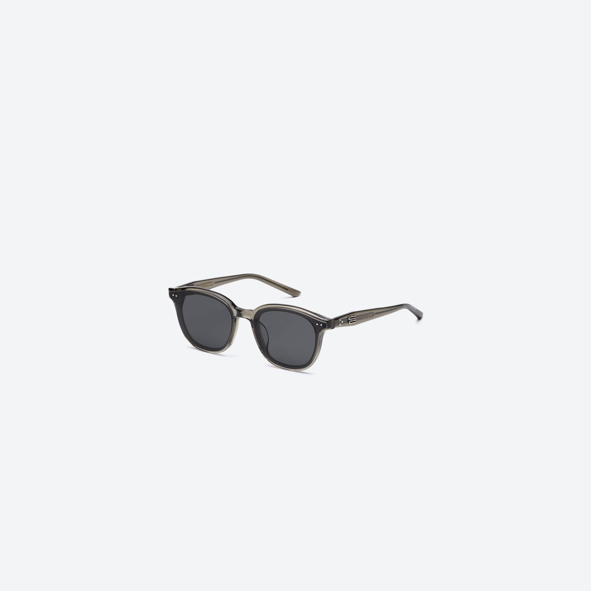 45-degree view of Gentle Monster Jude BRC17 Brown Acetate framed Round sunglasses.