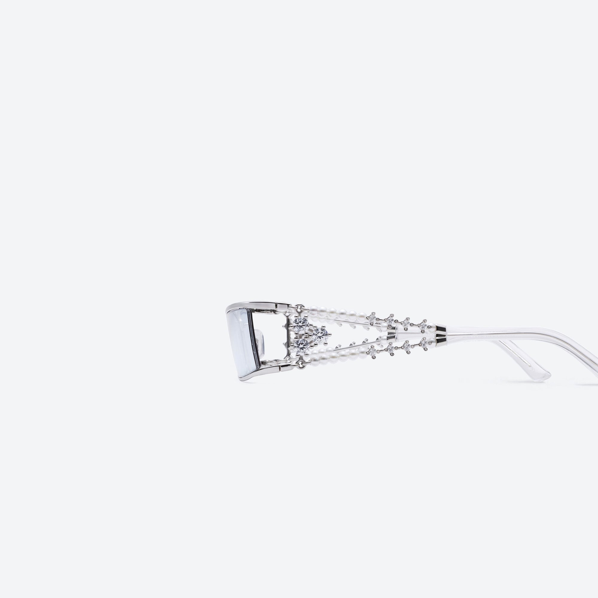 A detailed left view of Gentle Monster Kiira 02(BLM) Silver Metal framed Square sunglasses.