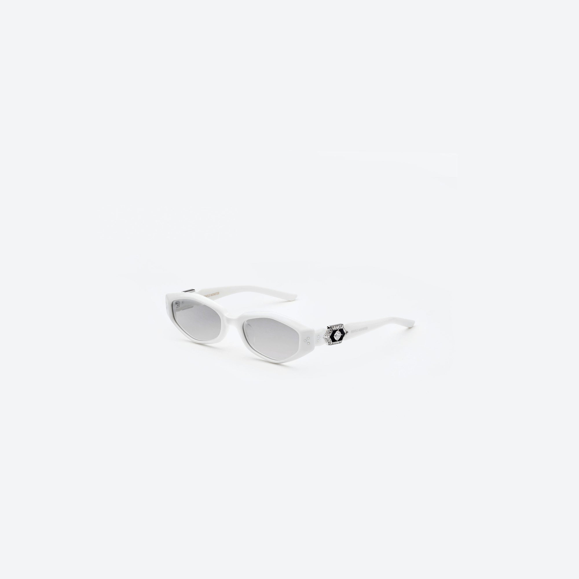 45-degree view of Gentle Monster Vegax W2 White Acetate framed Oval sunglasses.