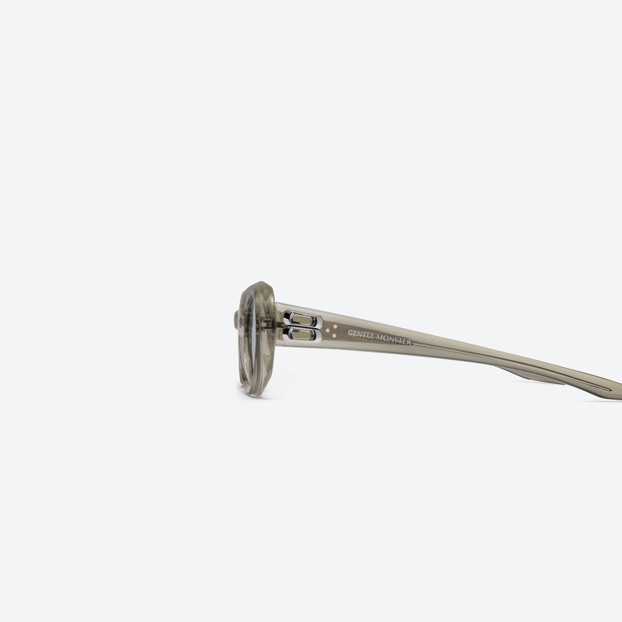 A detailed left view of Gentle Monster Cocoa BRC11 Brown Acetate framed Oval sunglasses.