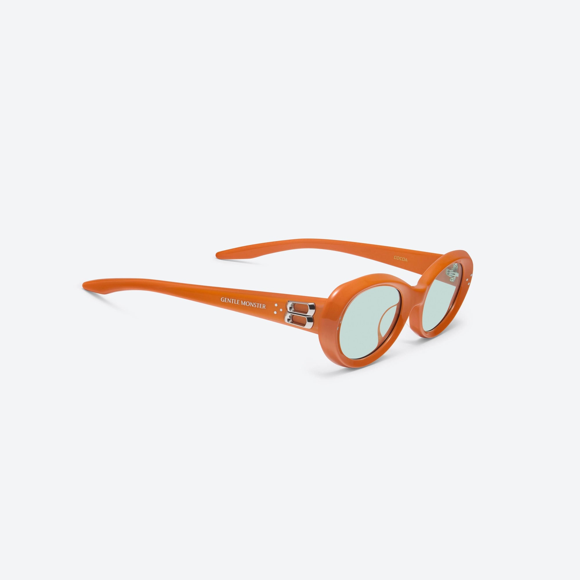 45-degree detailed view of Gentle Monster Cocoa OR3 Orange Acetate framed Oval sunglasses.
