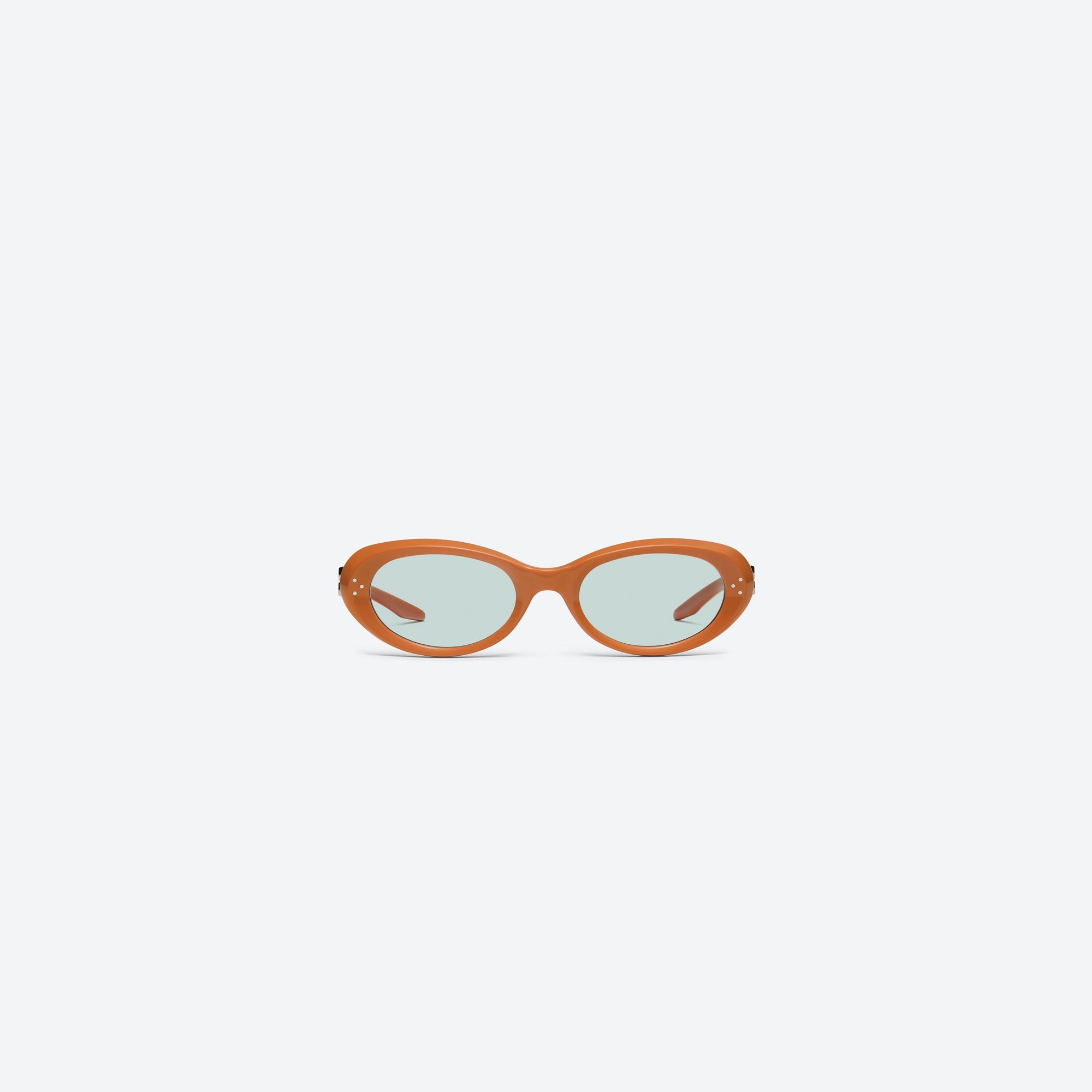 A front view of Gentle Monster Cocoa OR3 Orange Acetate framed Oval sunglasses.
