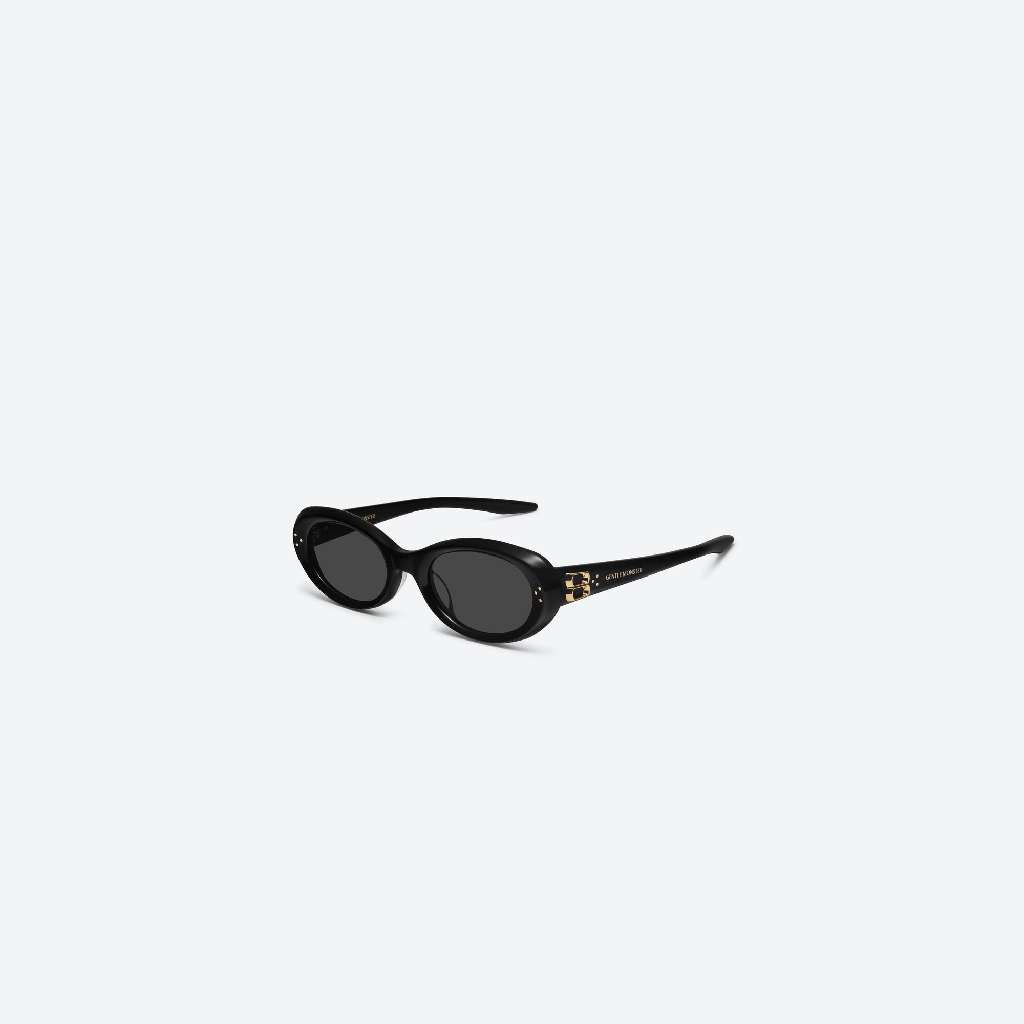 45-degree view of Gentle Monster Cocoa 01GD Similar Black Acetate framed Oval sunglasses.