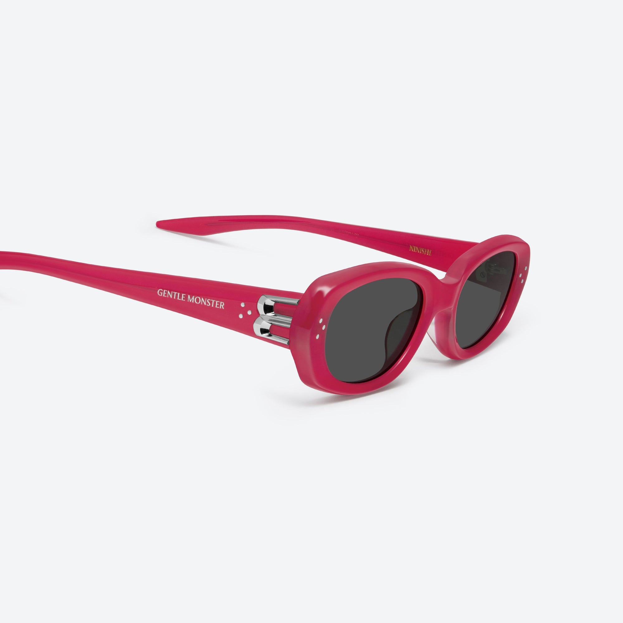 45-degree detailed view of Gentle Monster Ninishe RC6 Red Acetate framed Oval sunglasses.