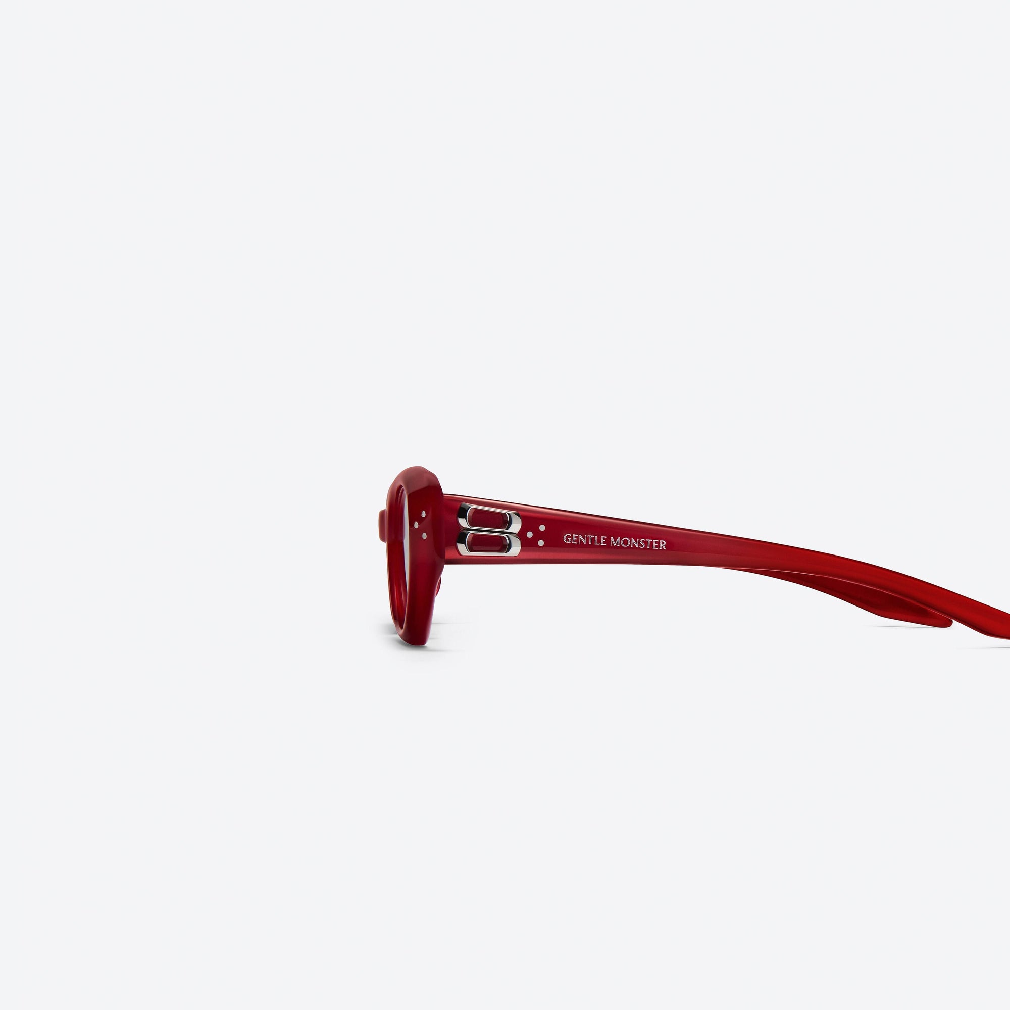 A detailed left view of Gentle Monster Duns R6 Red Acetate framed Cat-eye sunglasses.