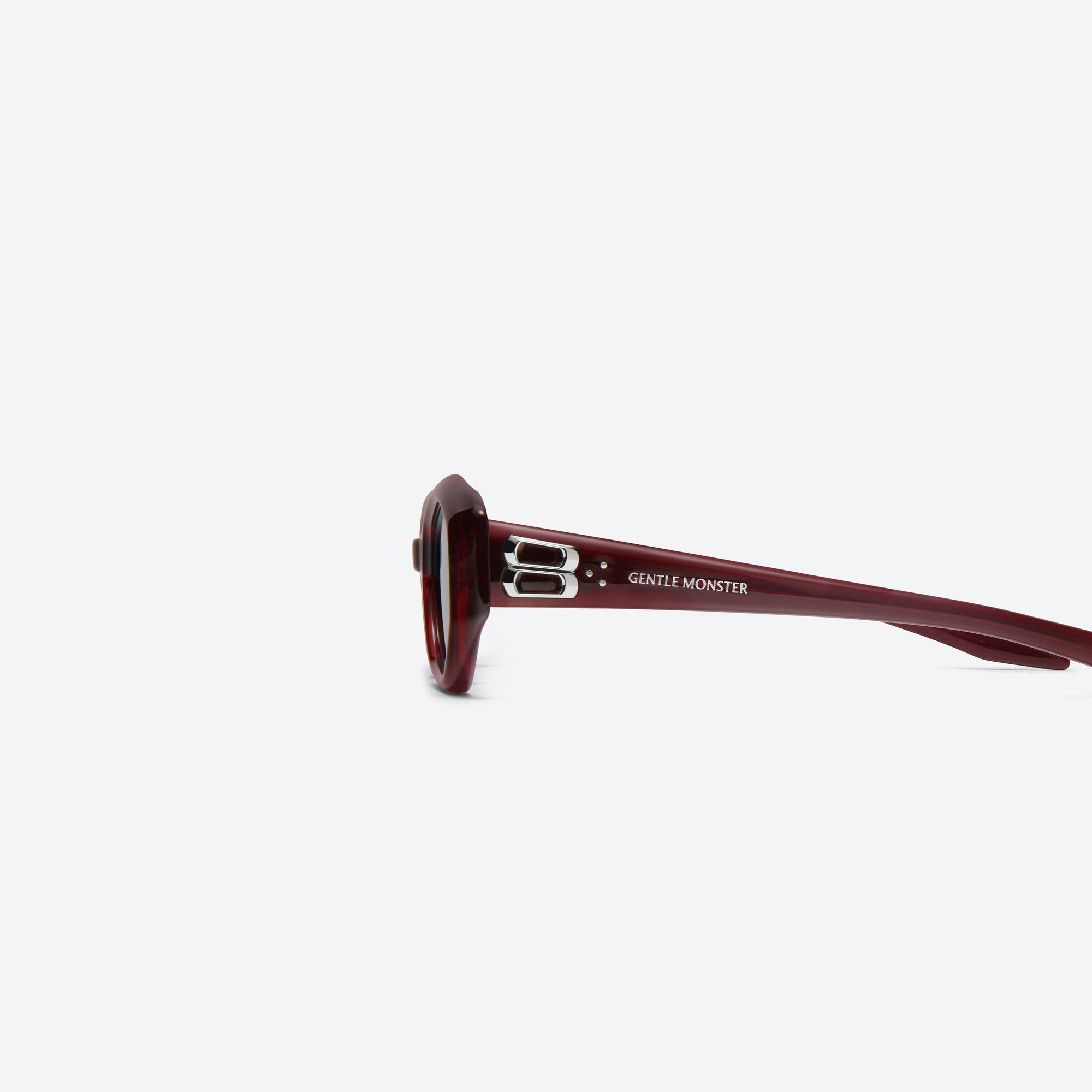 A detailed left view of Gentle Monster Miro RC3 Red Acetate framed Oval sunglasses.