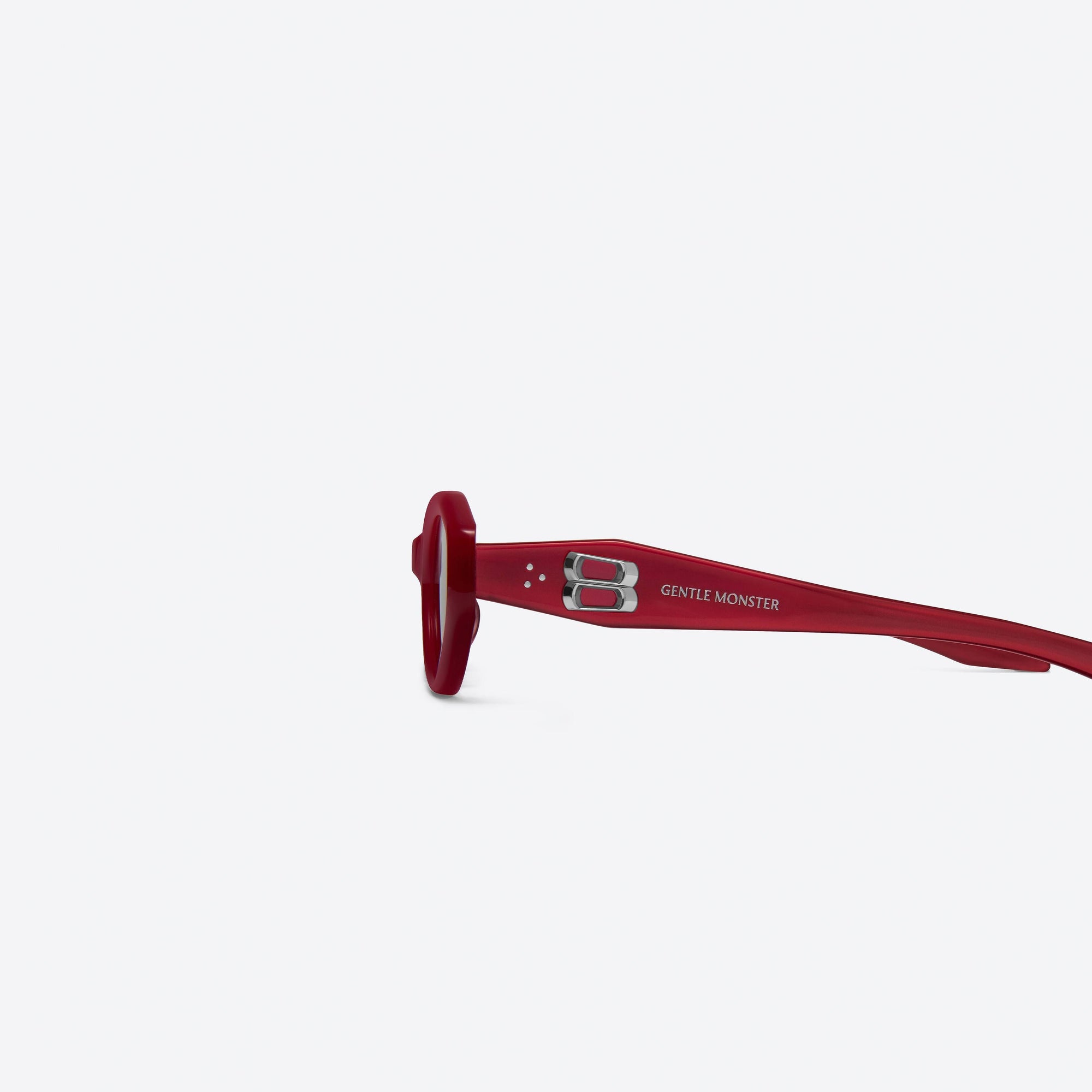 A detailed left view of Gentle Monster Vamp R6 Red Acetate framed Oval sunglasses.