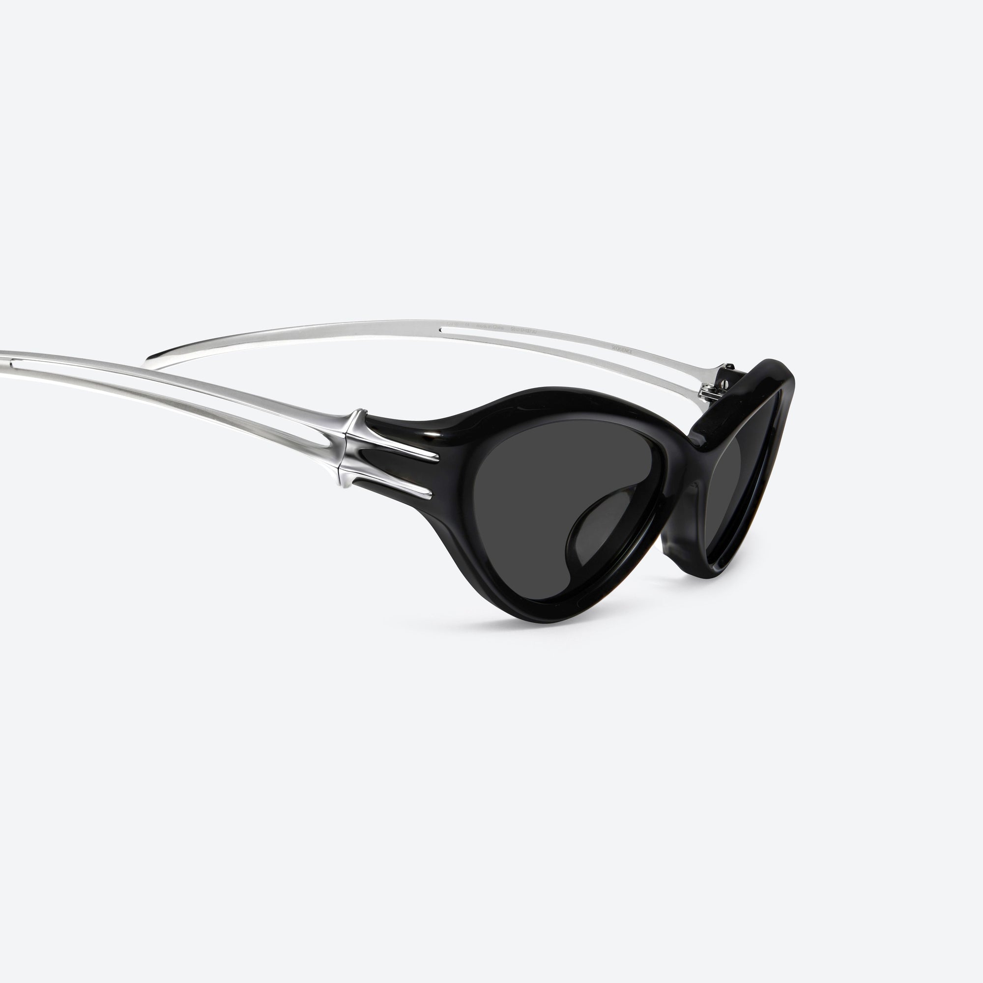 45-degree detailed view of Gentle Monster Sequence 01 Black Mixed framed Wraparound sunglasses.