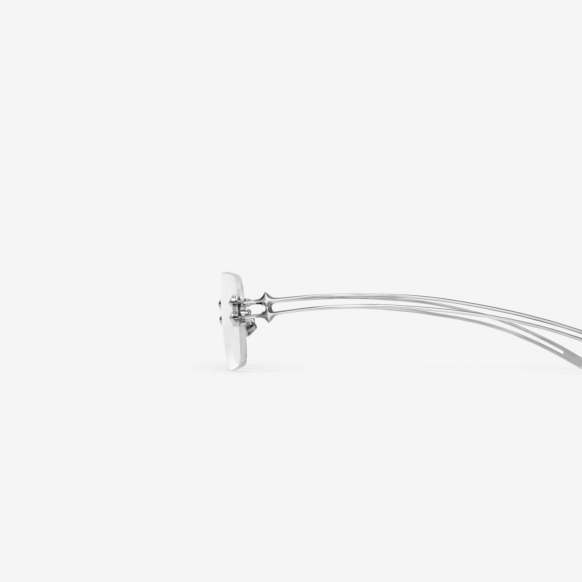 A detailed left view of Gentle Monster Tetra 02 Silver Metal framed Square sunglasses.