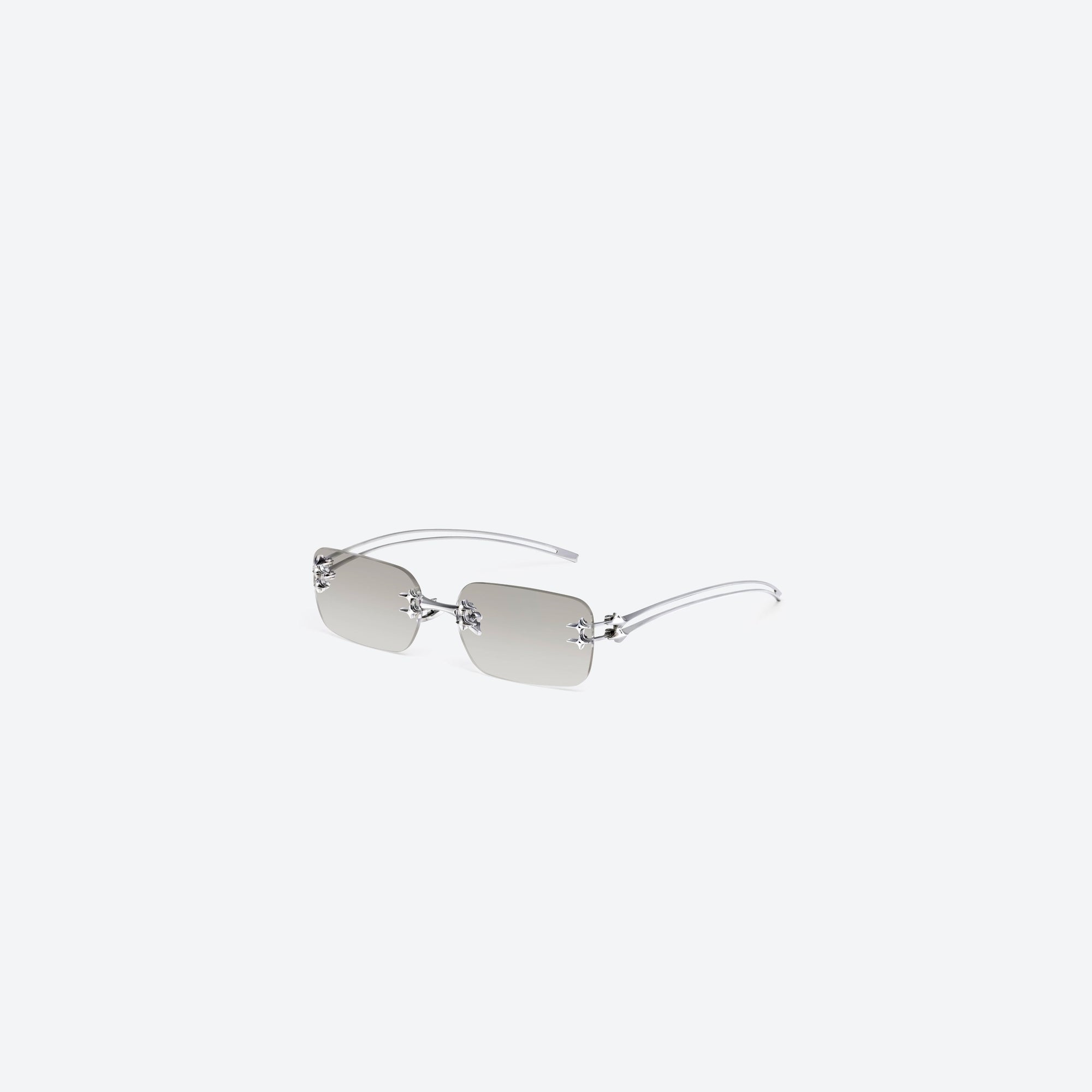 45-degree view of Gentle Monster Tetra 02(BRM) Silver Metal framed Square sunglasses.