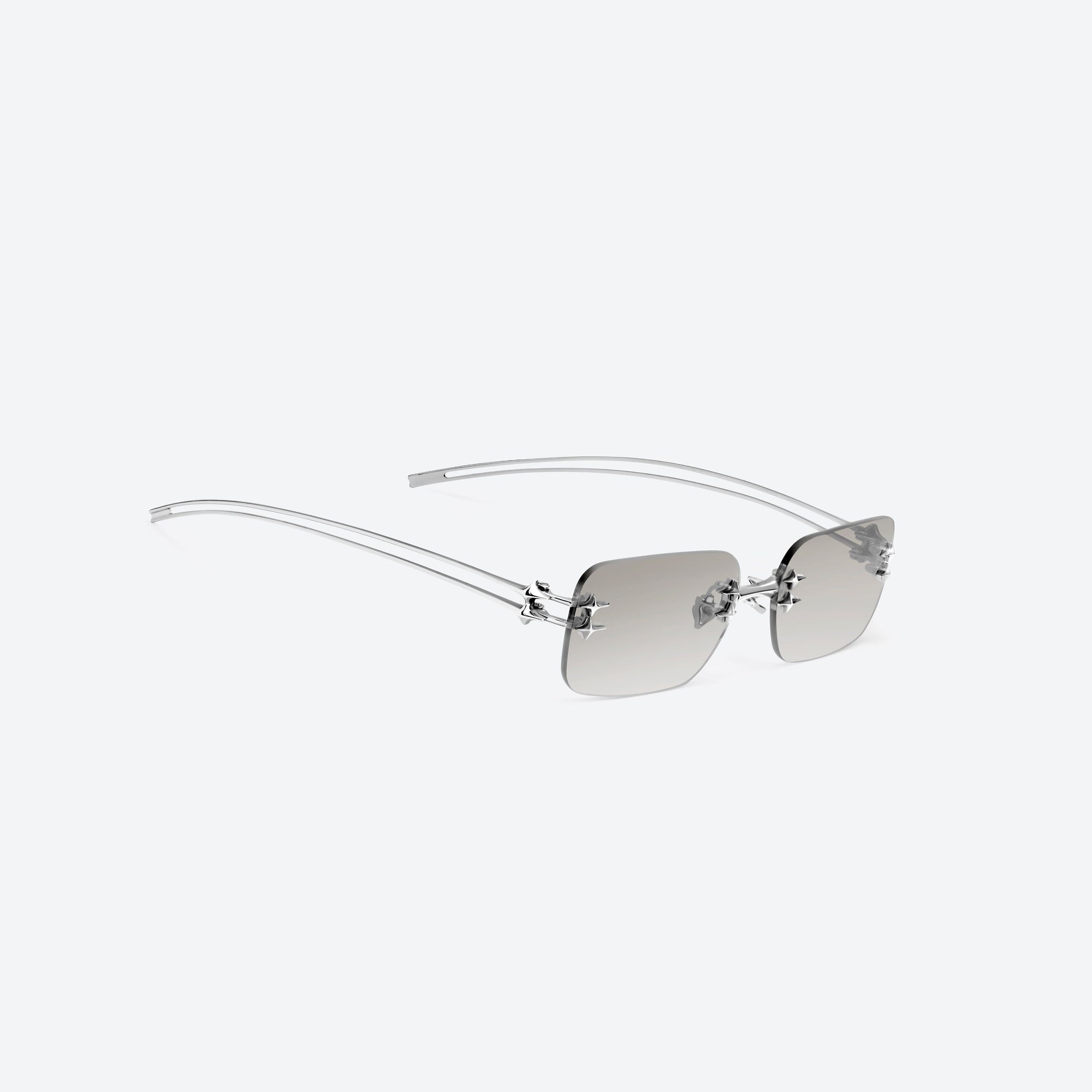 45-degree detailed view of Gentle Monster Tetra 02(BRM) Silver Metal framed Square sunglasses.