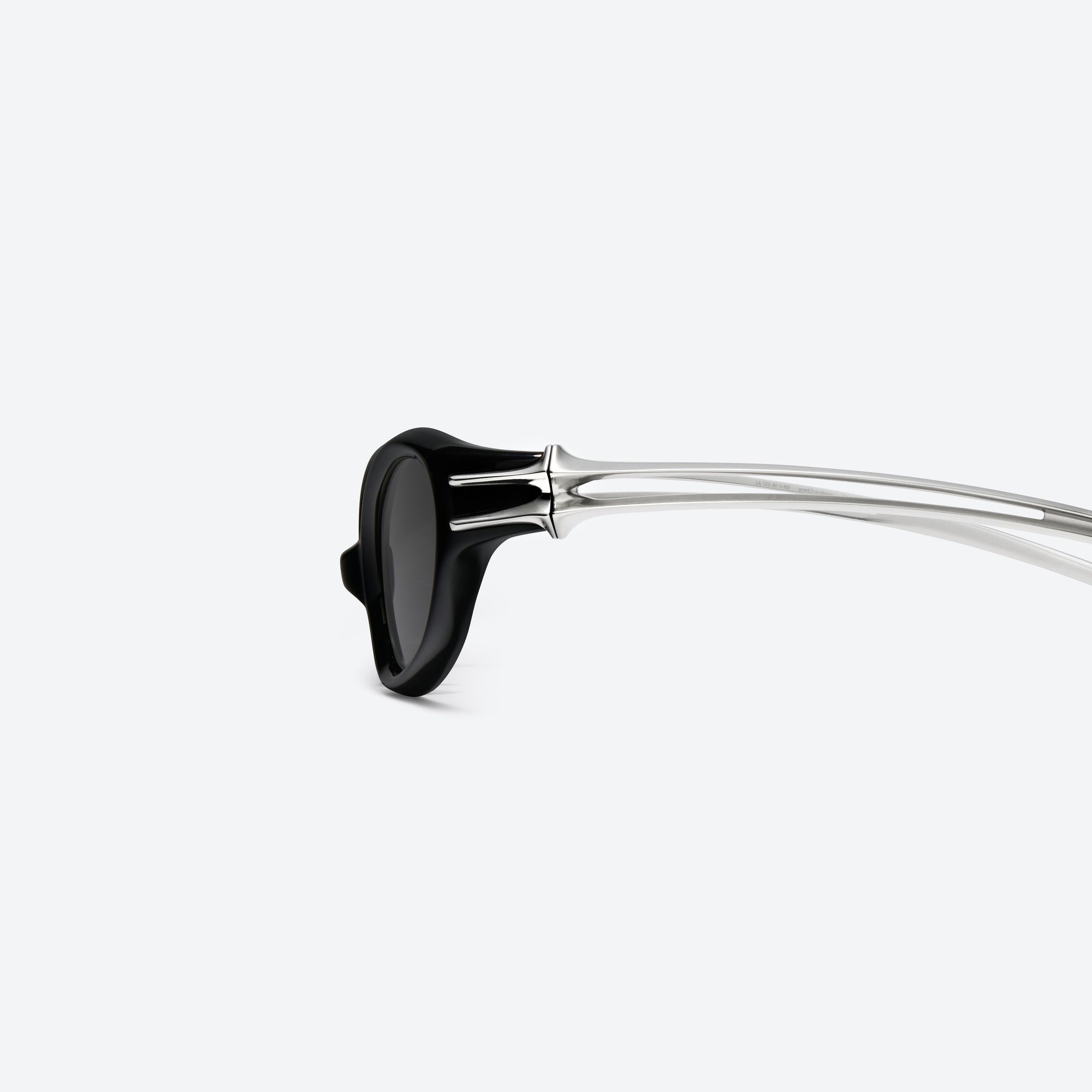 A detailed left view of Gentle Monster Ximul 01 Black Mixed framed Cat-eye sunglasses.