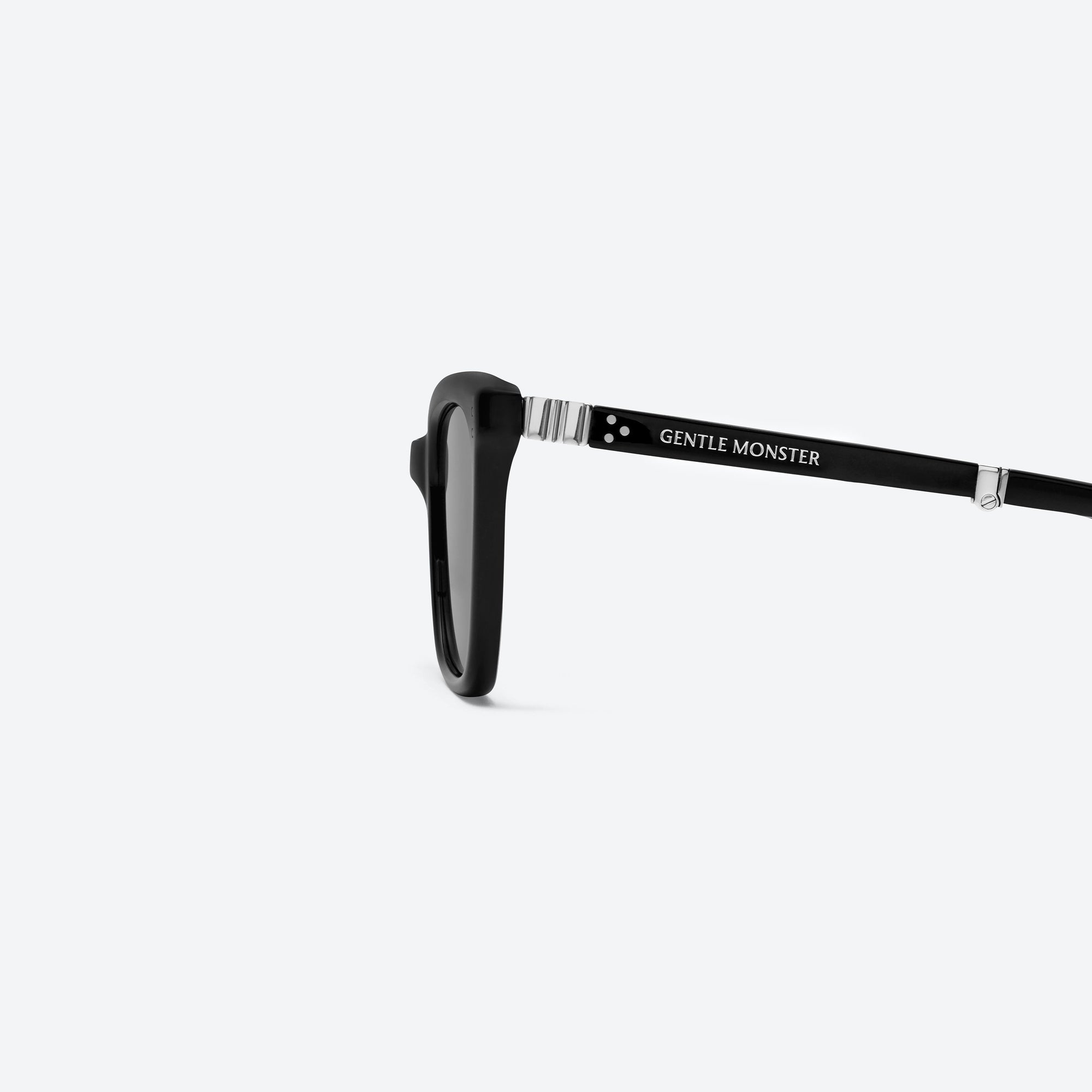 A detailed left view of Gentle Monster Matiny 01 Black Acetate framed Square sunglasses.