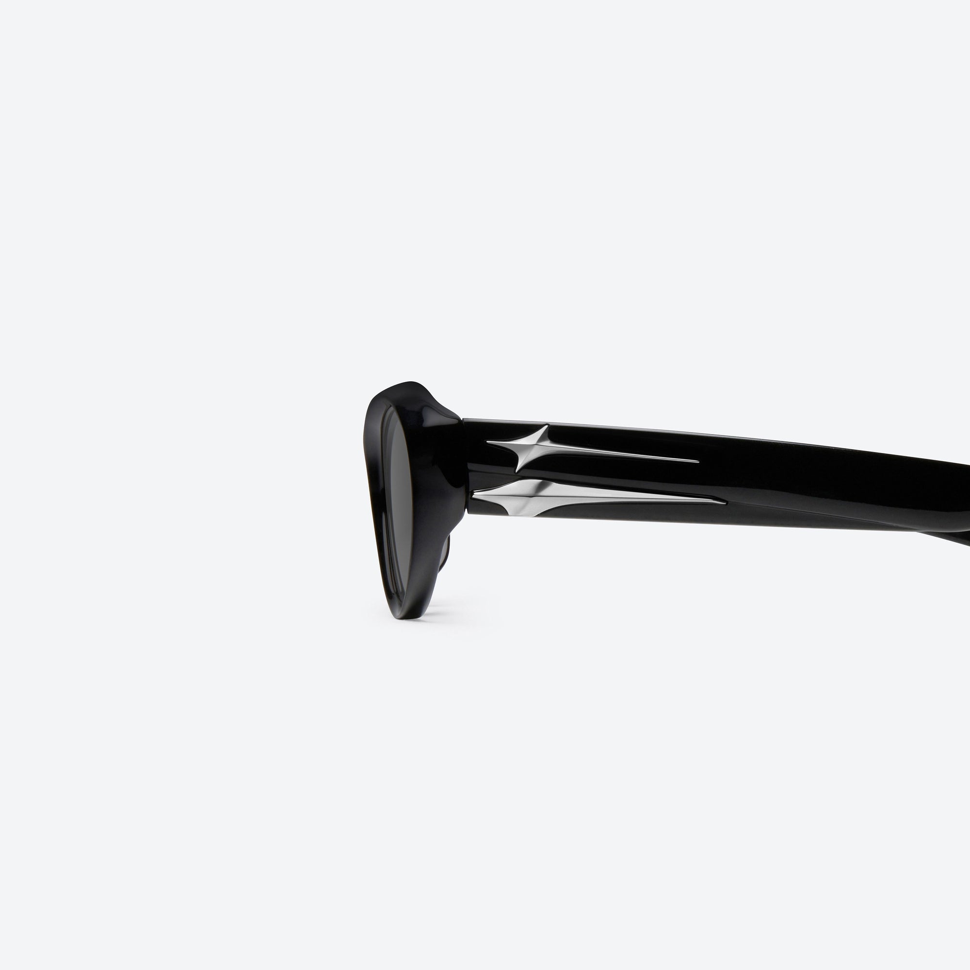 A detailed left view of Gentle Monster Eq 01 Black Acetate framed Cat-eye sunglasses.