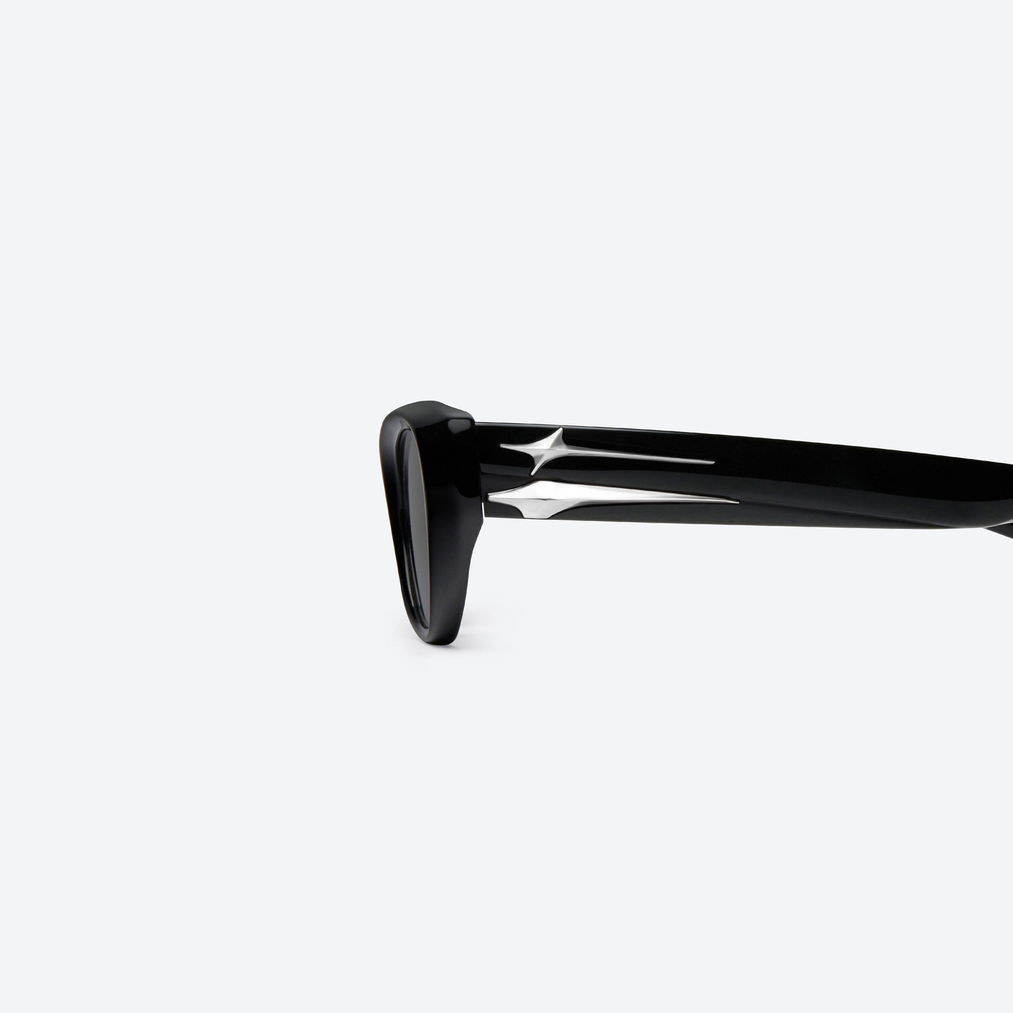 A detailed left view of Gentle Monster Verse 01 Black Acetate framed Cat-eye sunglasses.