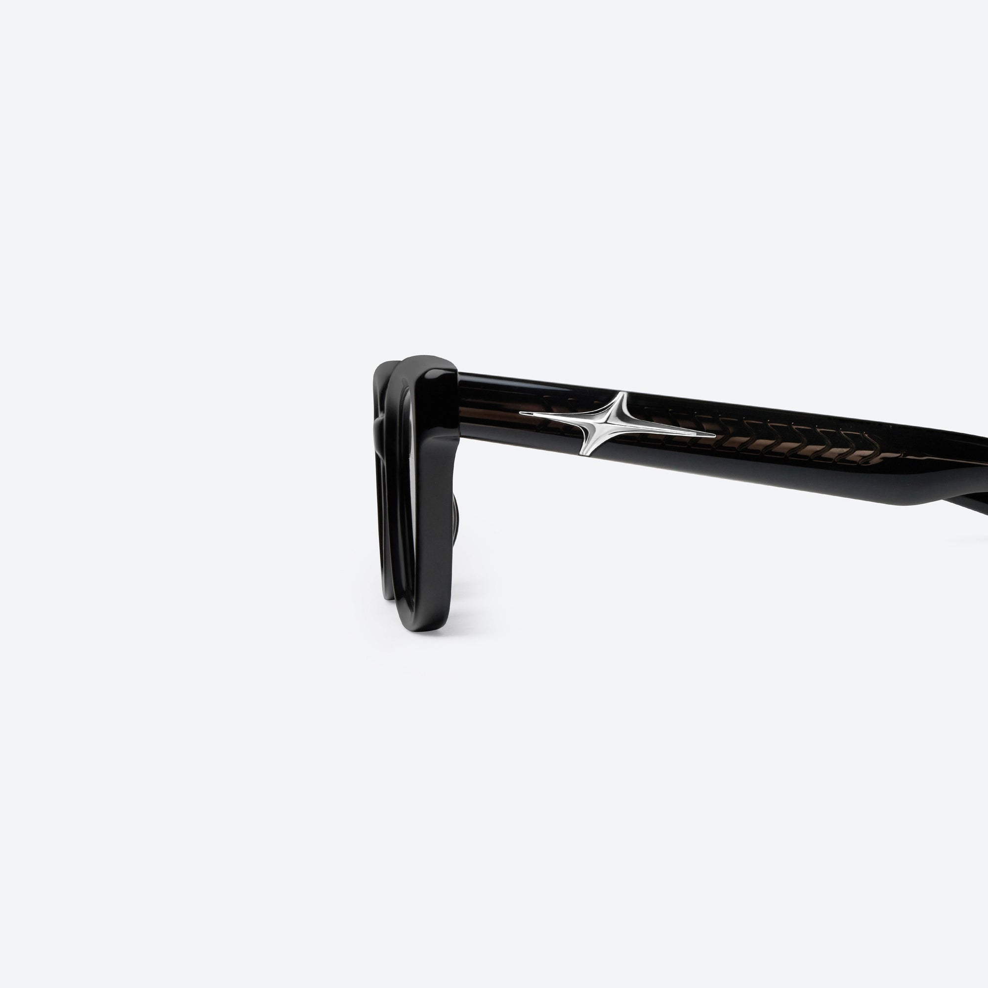 A detailed left view of Gentle Monster Hesse 01 Black Acetate framed Square sunglasses.