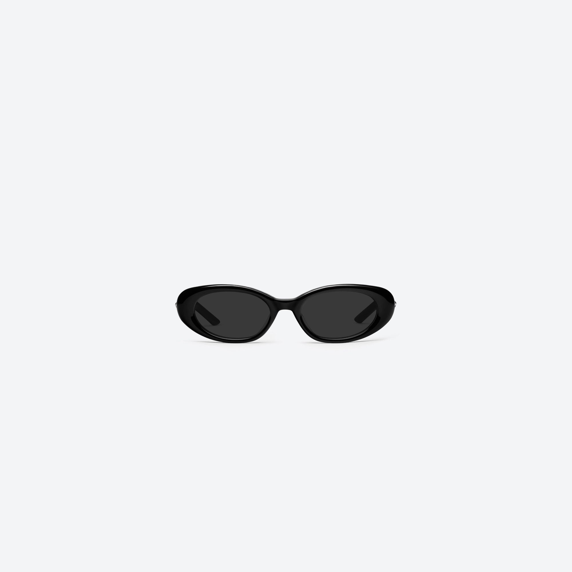 A front view of Gentle Monster Loco 01 Black Acetate framed Oval sunglasses.