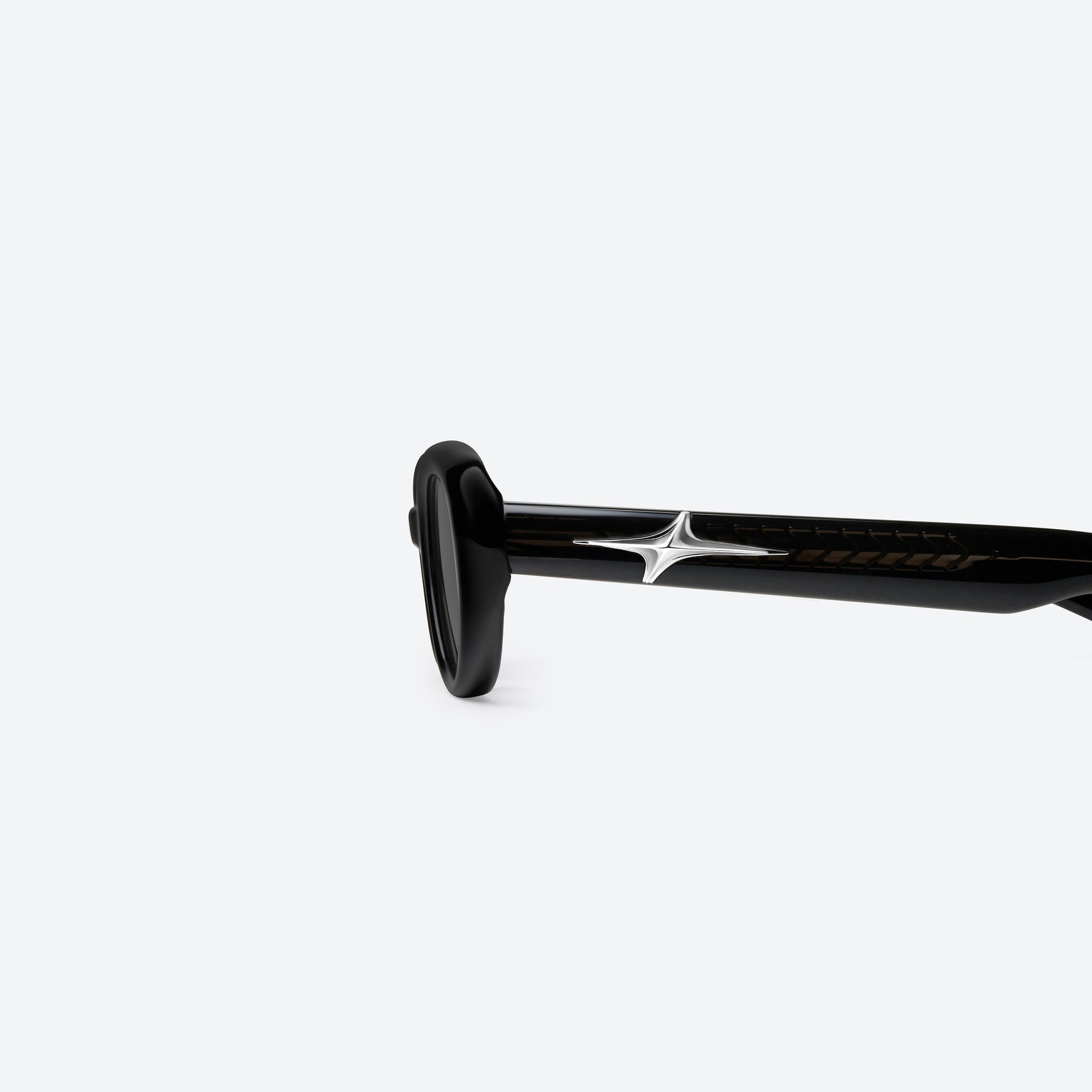 A detailed left view of Gentle Monster Loco 01 Black Acetate framed Oval sunglasses.