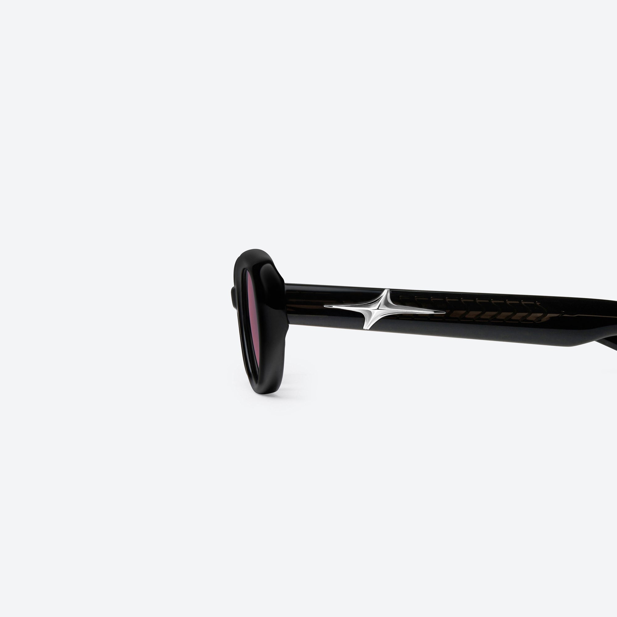 A detailed left view of Gentle Monster Loco 01(R) Black Acetate framed Oval sunglasses.