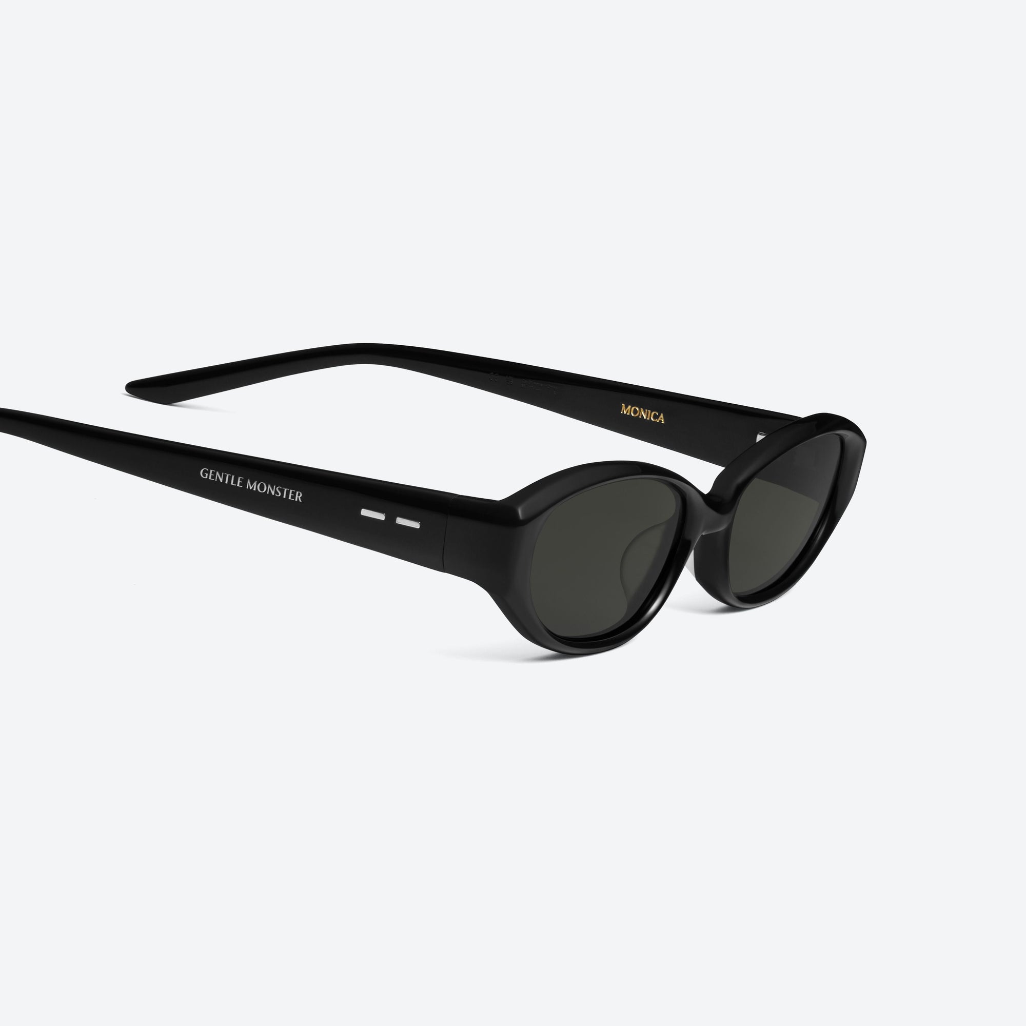 45-degree detailed view of Gentle Monster Monica 01 Black Acetate framed Cat-eye sunglasses.