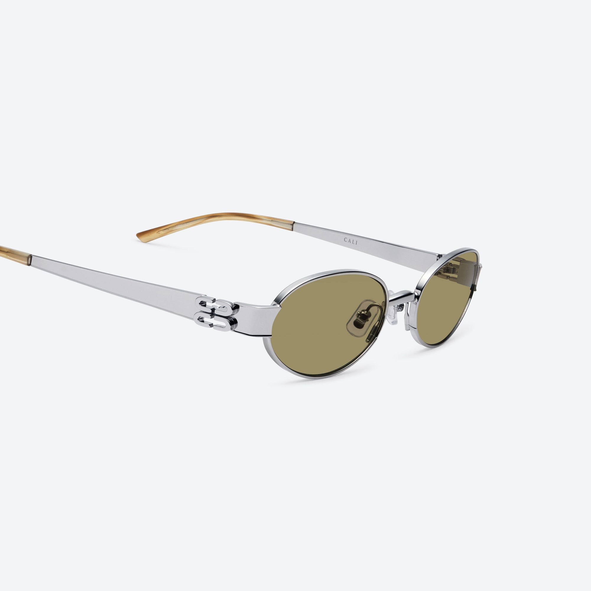 45-degree detailed view of Gentle Monster Cali 02(BR) Similar Silver Metal framed Oval sunglasses.