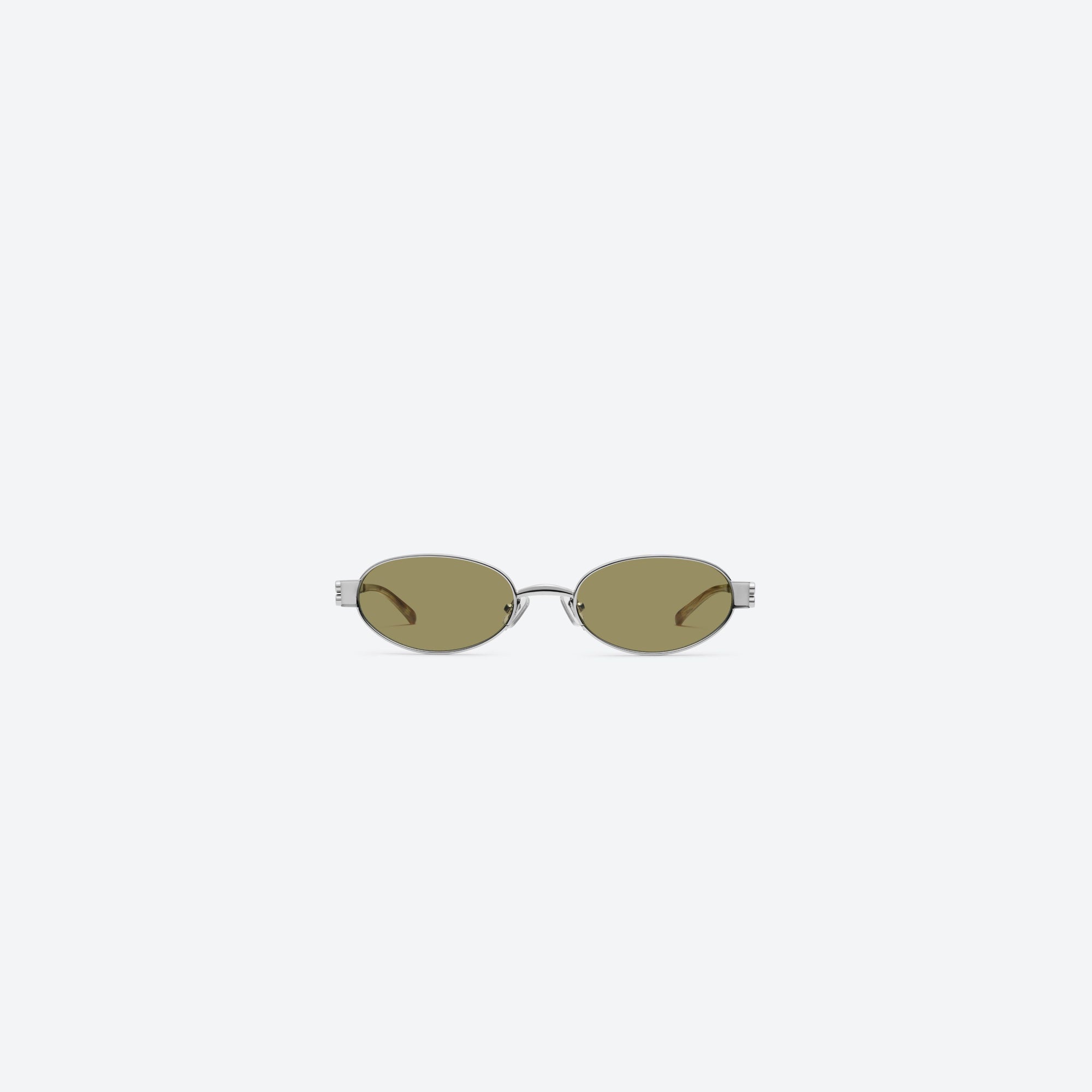 A front view of Gentle Monster Cali 02(BR) Similar Silver Metal framed Oval sunglasses.