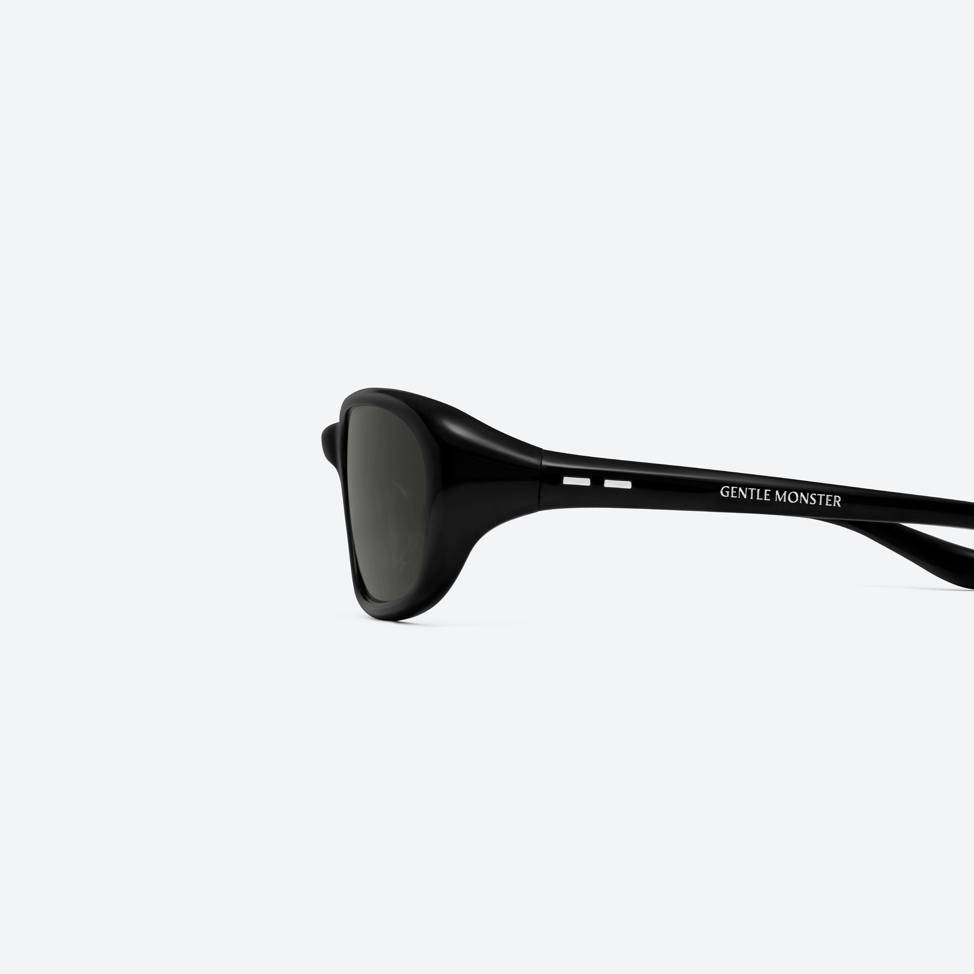 A detailed left view of Gentle Monster Hills 01 Black Acetate framed Wraparound sunglasses.