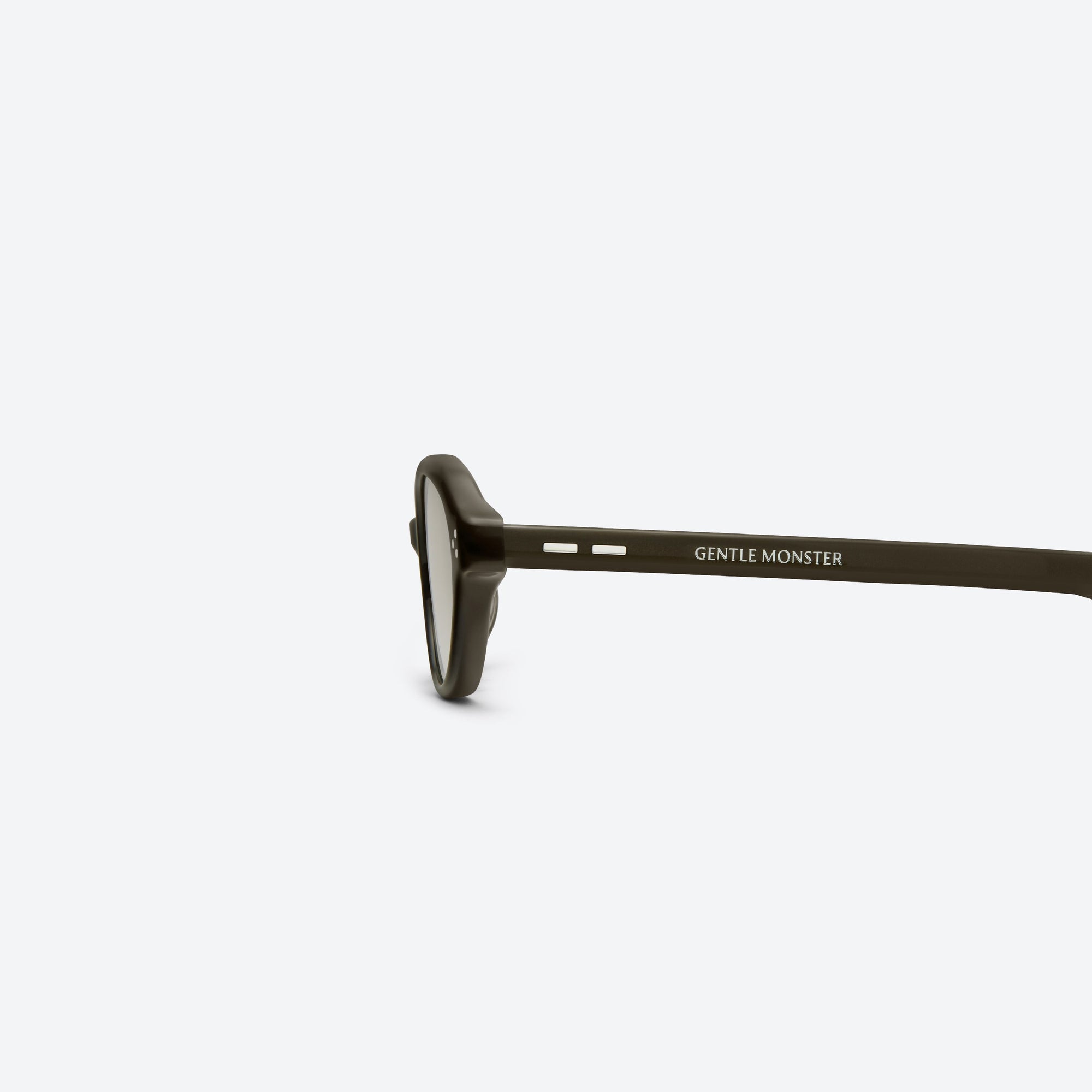 A detailed left view of Gentle Monster La Cha BR4 Brown Acetate framed Round sunglasses.