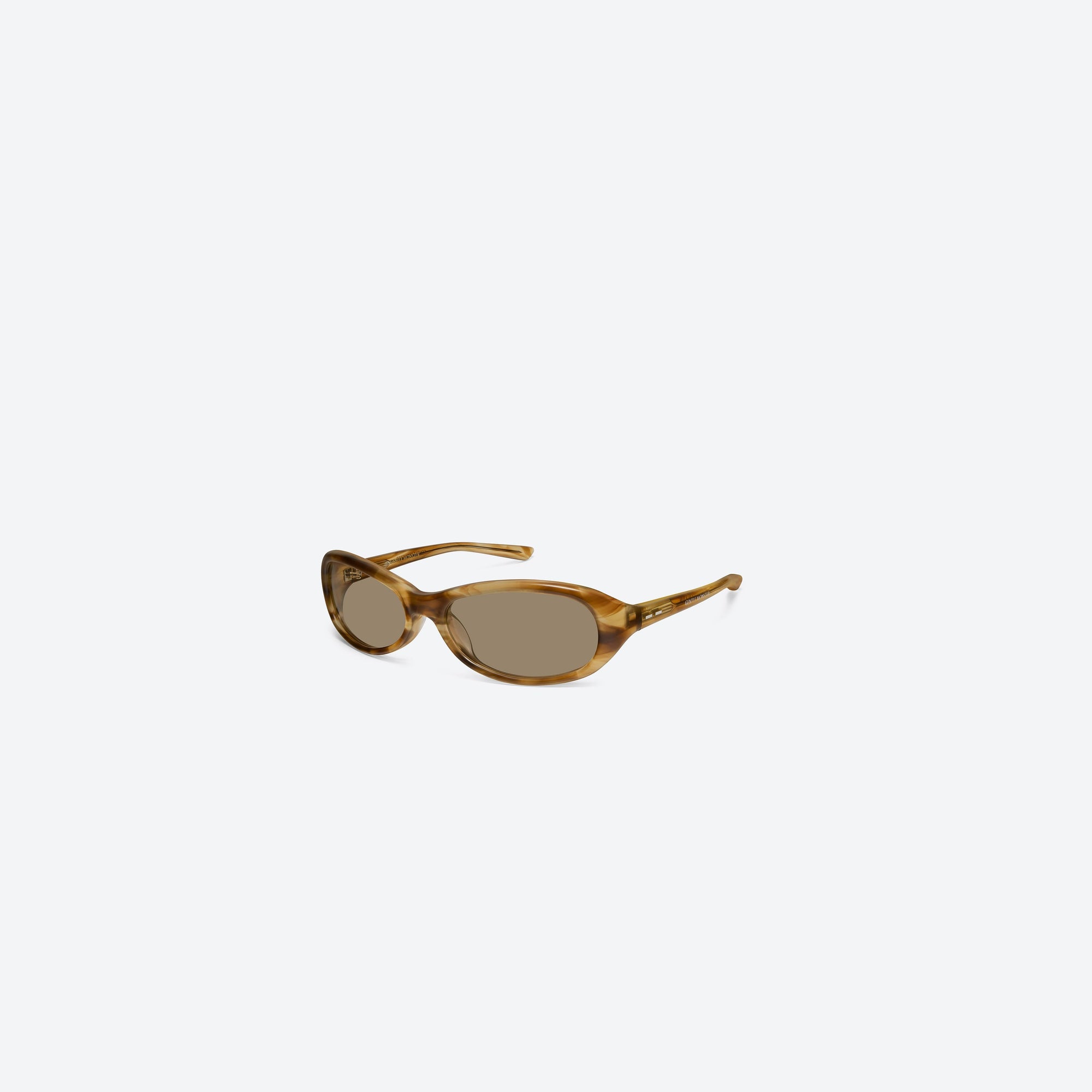 45-degree view of Gentle Monster Groovy T8 Tortoise Acetate framed Wraparound sunglasses.