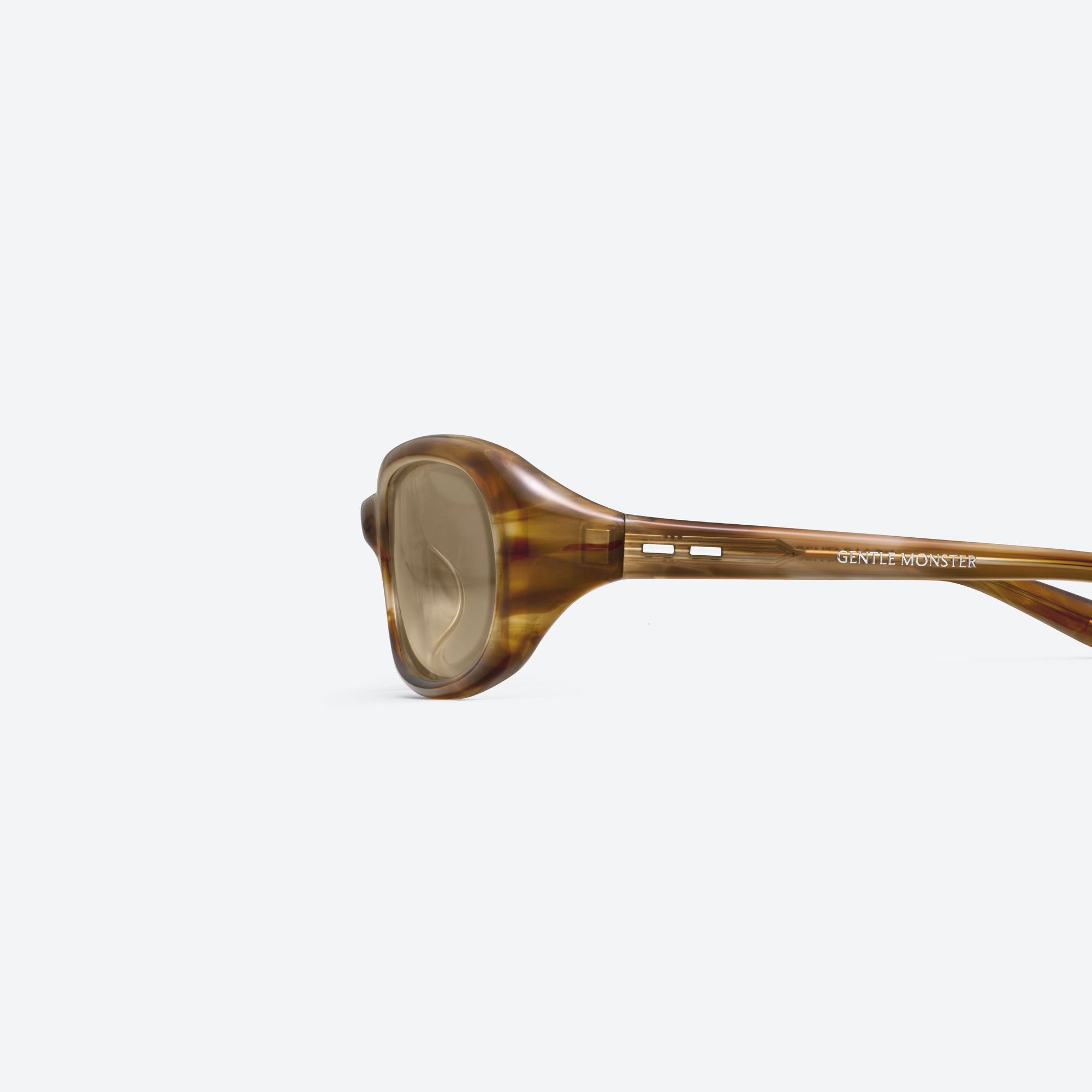 A detailed left view of Gentle Monster Groovy T8 Tortoise Acetate framed Wraparound sunglasses.