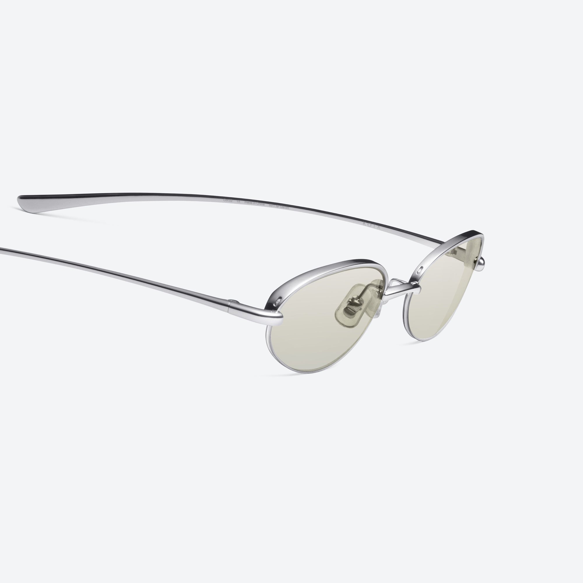 45-degree detailed view of Gentle Monster Kota 02(GRM) Similar Silver Metal framed Oval sunglasses.