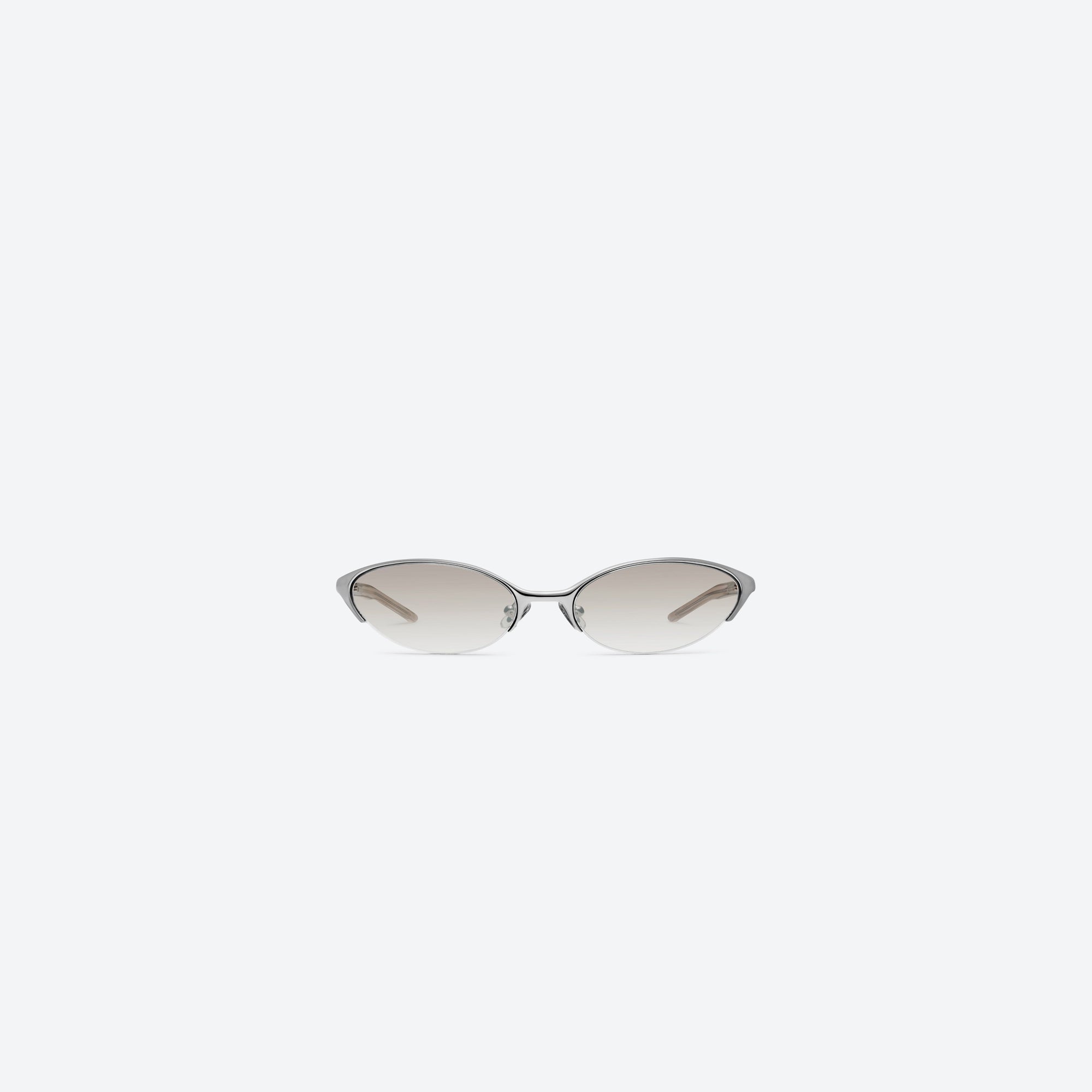 A front view of Gentle Monster Limes 02(BR) Similar Silver Mixed framed Cat-eye sunglasses.