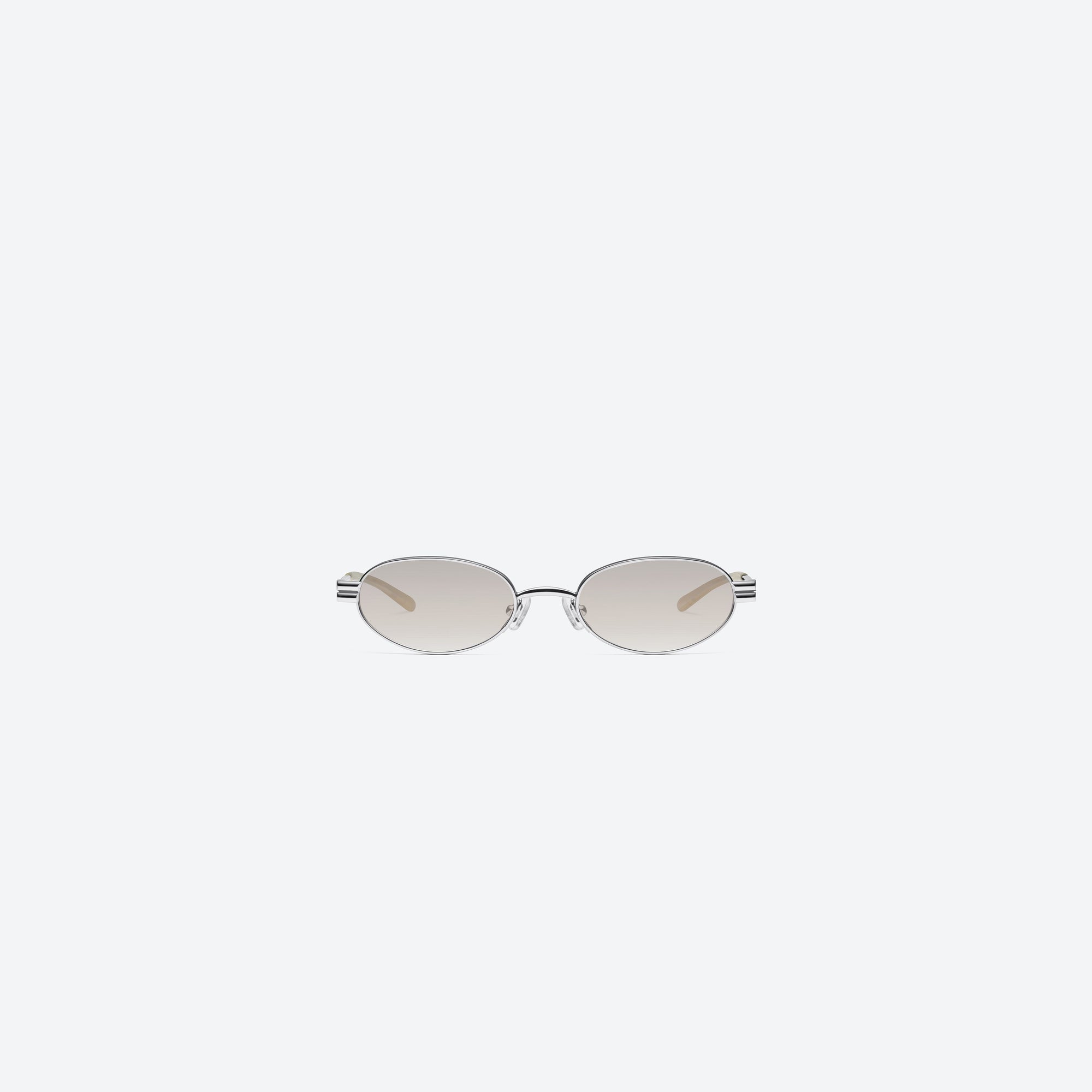 A front view of Gentle Monster Lolos 02(BR) Similar Silver Metal framed Oval sunglasses.