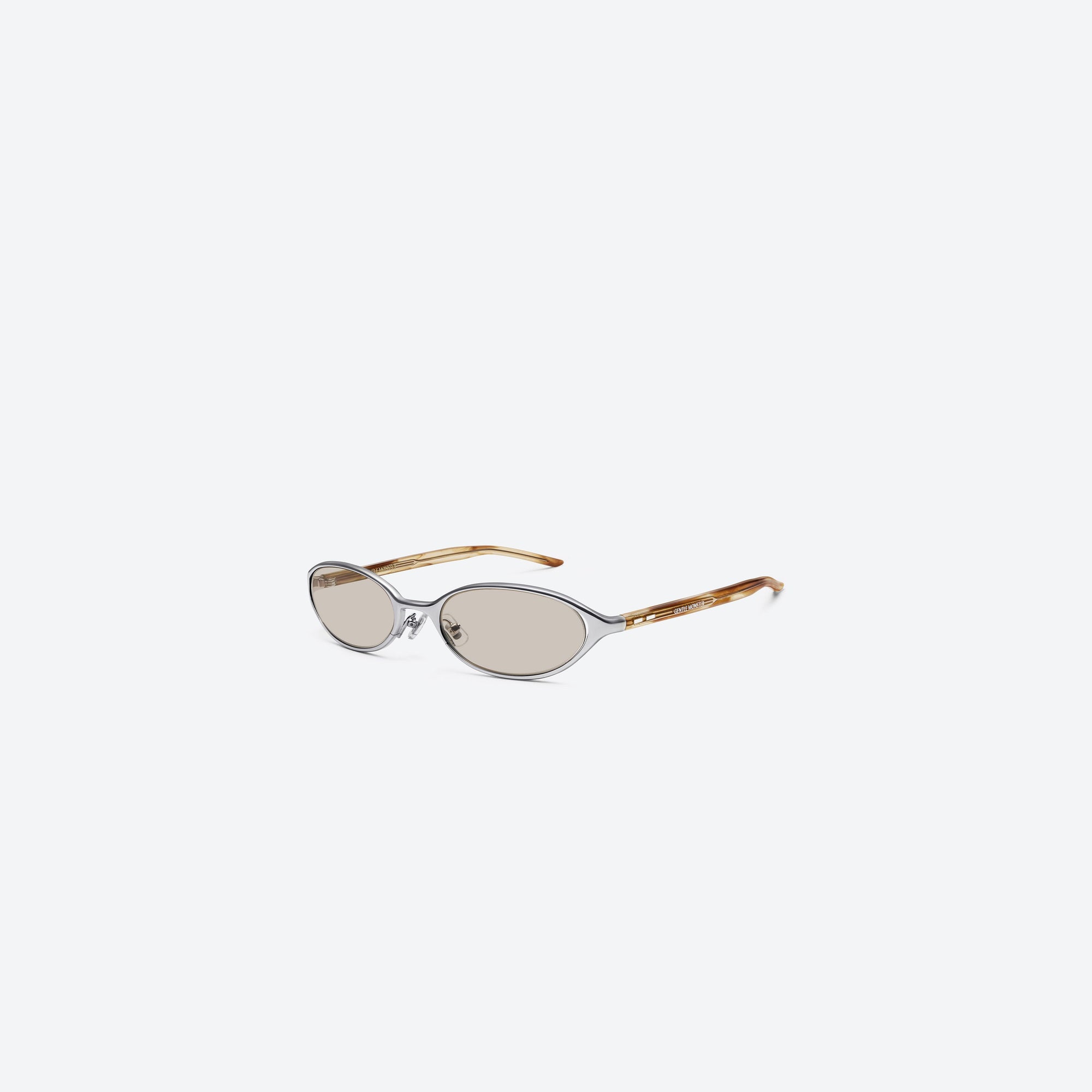 45-degree view of Gentle Monster Moody 02(BR) Similar Silver Mixed framed Oval sunglasses.