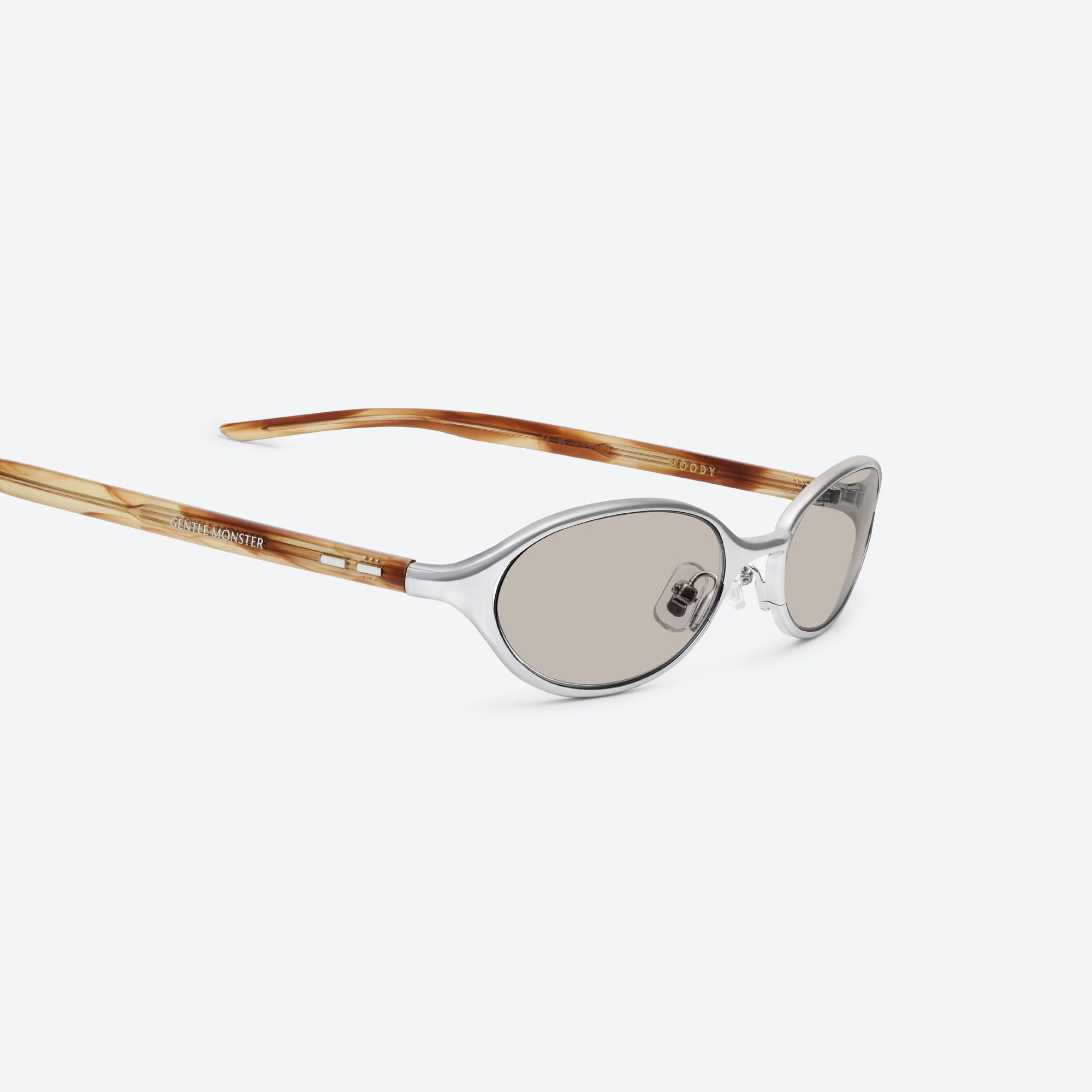 45-degree detailed view of Gentle Monster Moody 02(BR) Similar Silver Mixed framed Oval sunglasses.
