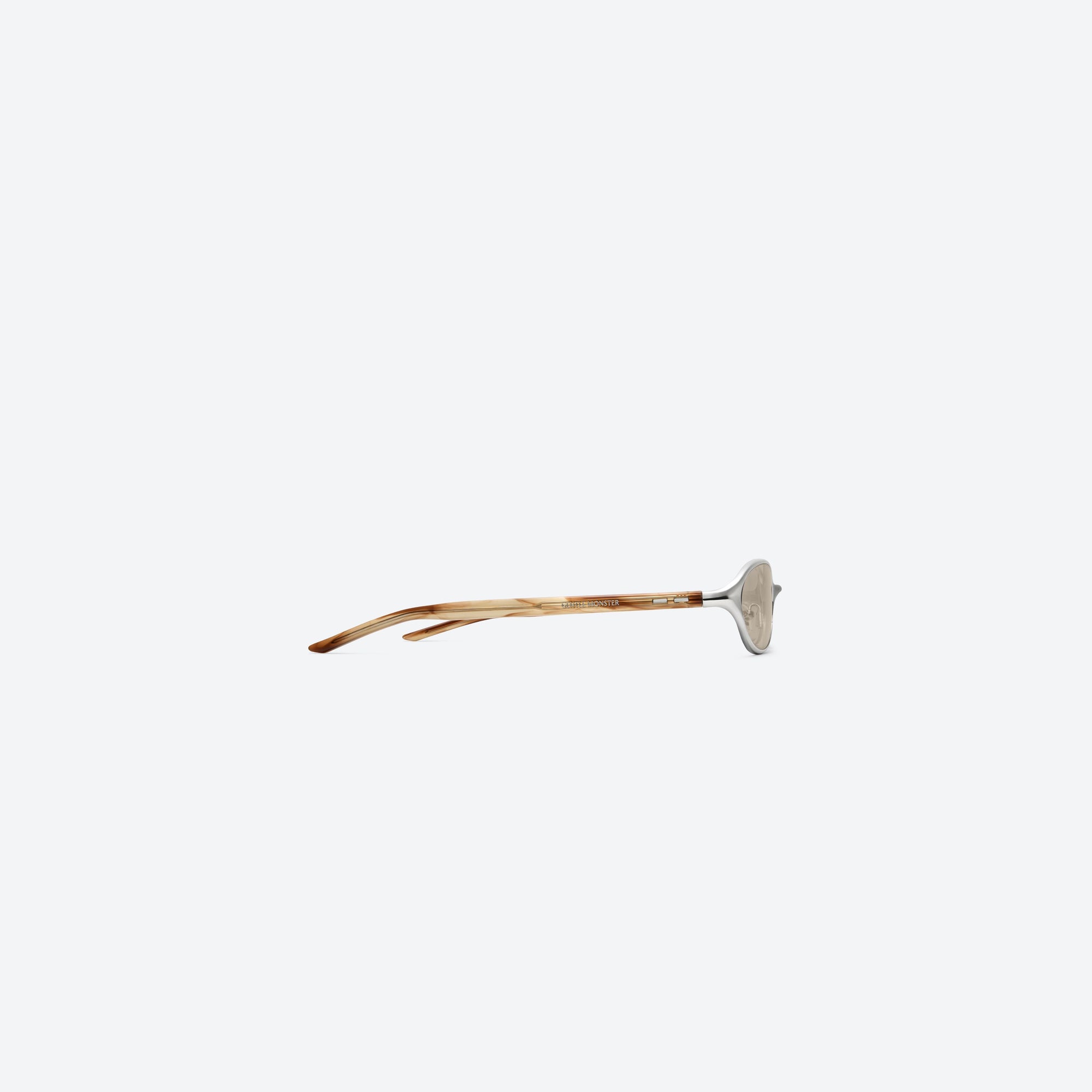 A detailed right view of Gentle Monster Moody 02(BR) Similar Silver Mixed framed Oval sunglasses.