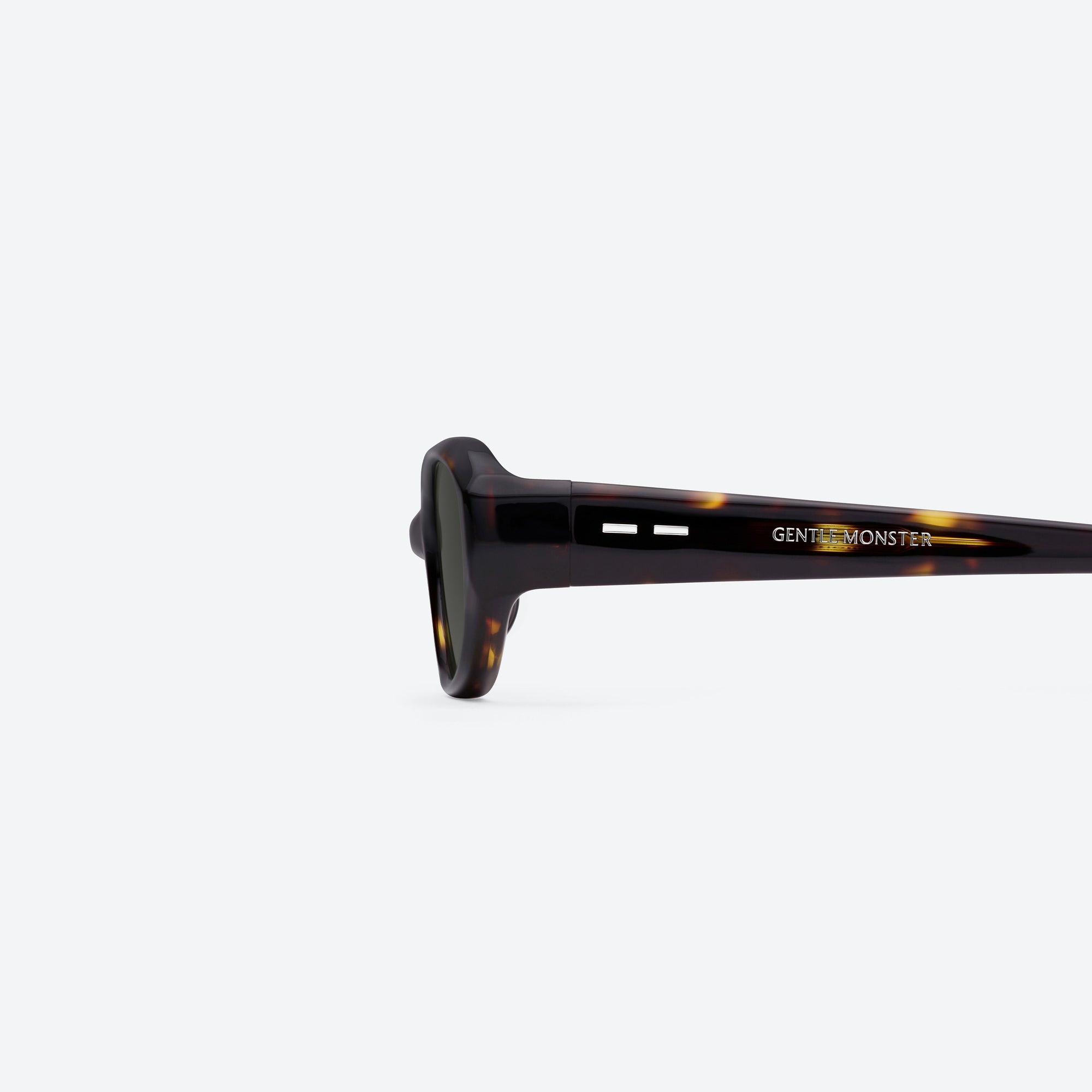 A detailed left view of Gentle Monster Monica T9 Tortoise Acetate framed Cat-eye sunglasses.