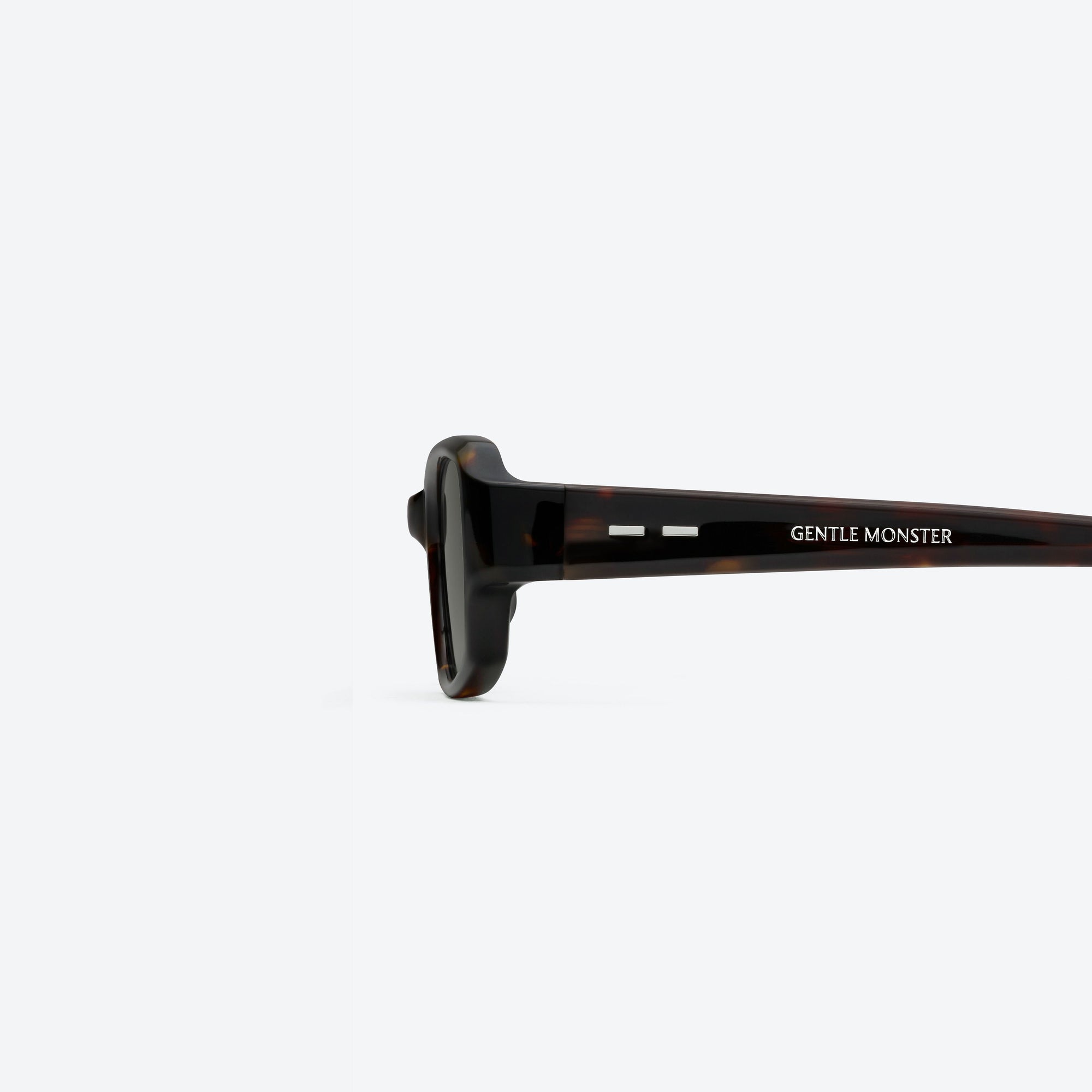 A detailed left view of Gentle Monster Halo T1 Tortoise Acetate framed Square sunglasses.