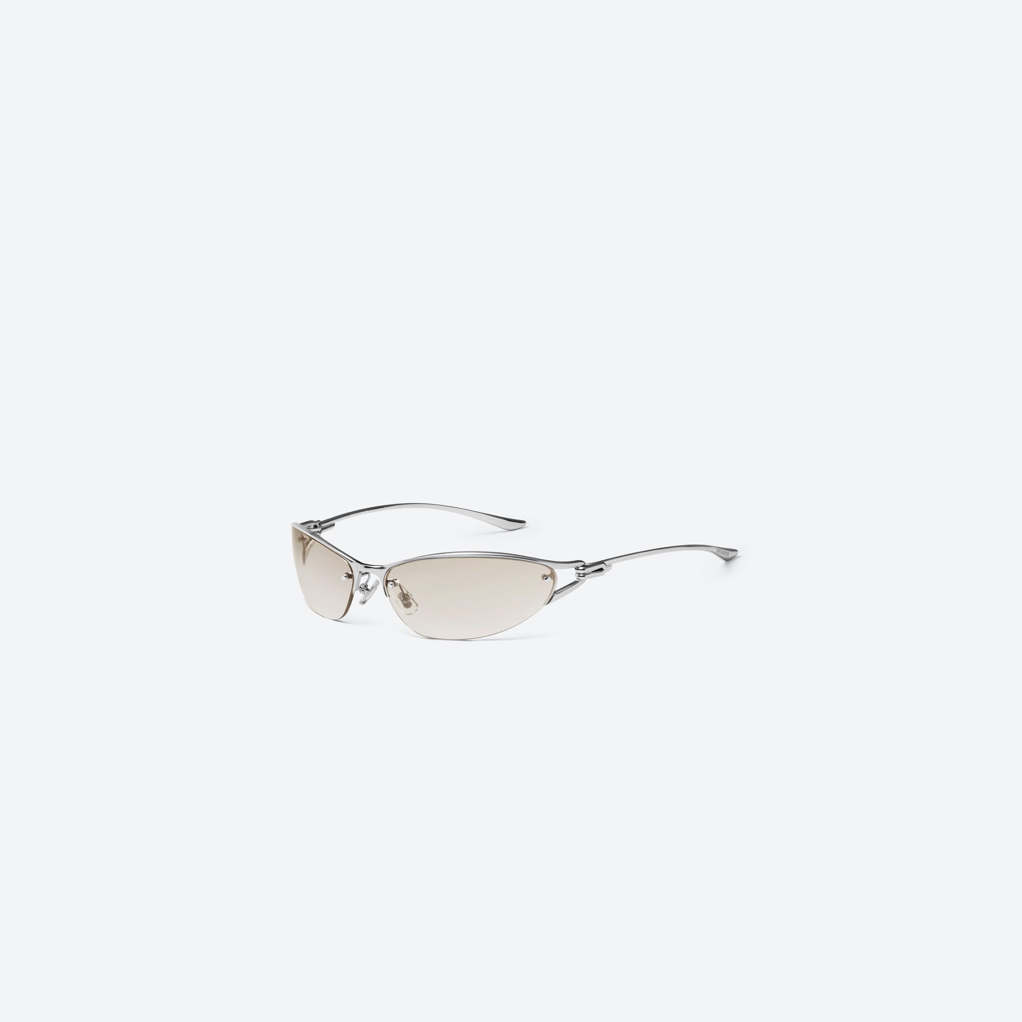 45-degree view of Gentle Monster Futura 02 Silver Metal framed Wraparound sunglasses.