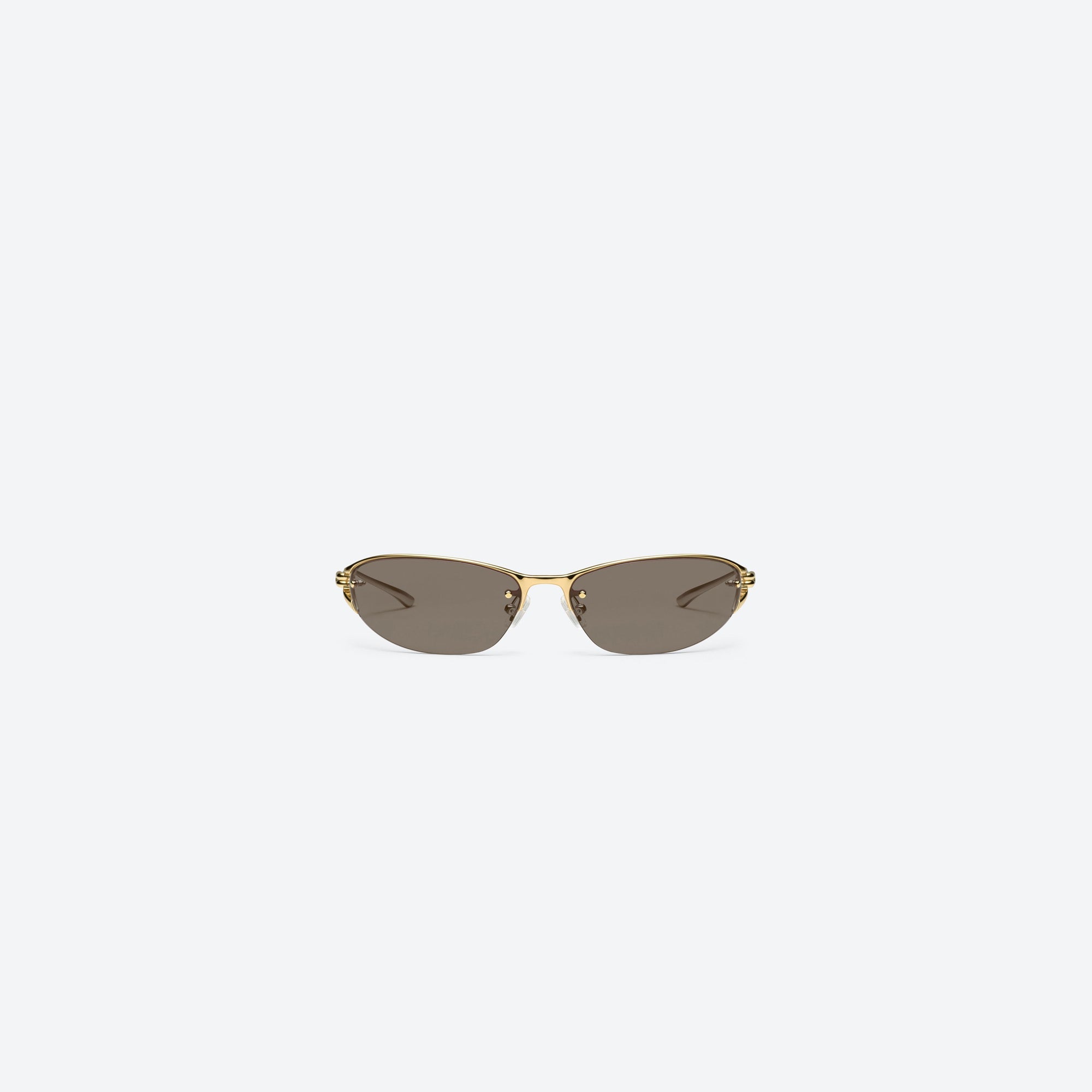A front view of Gentle Monster Futura 03 Gold Metal framed Wraparound sunglasses.