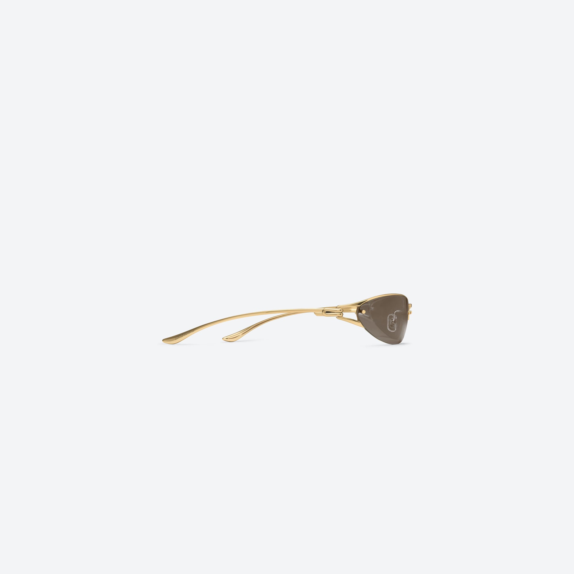 A detailed right view of Gentle Monster Futura 03 Gold Metal framed Wraparound sunglasses.