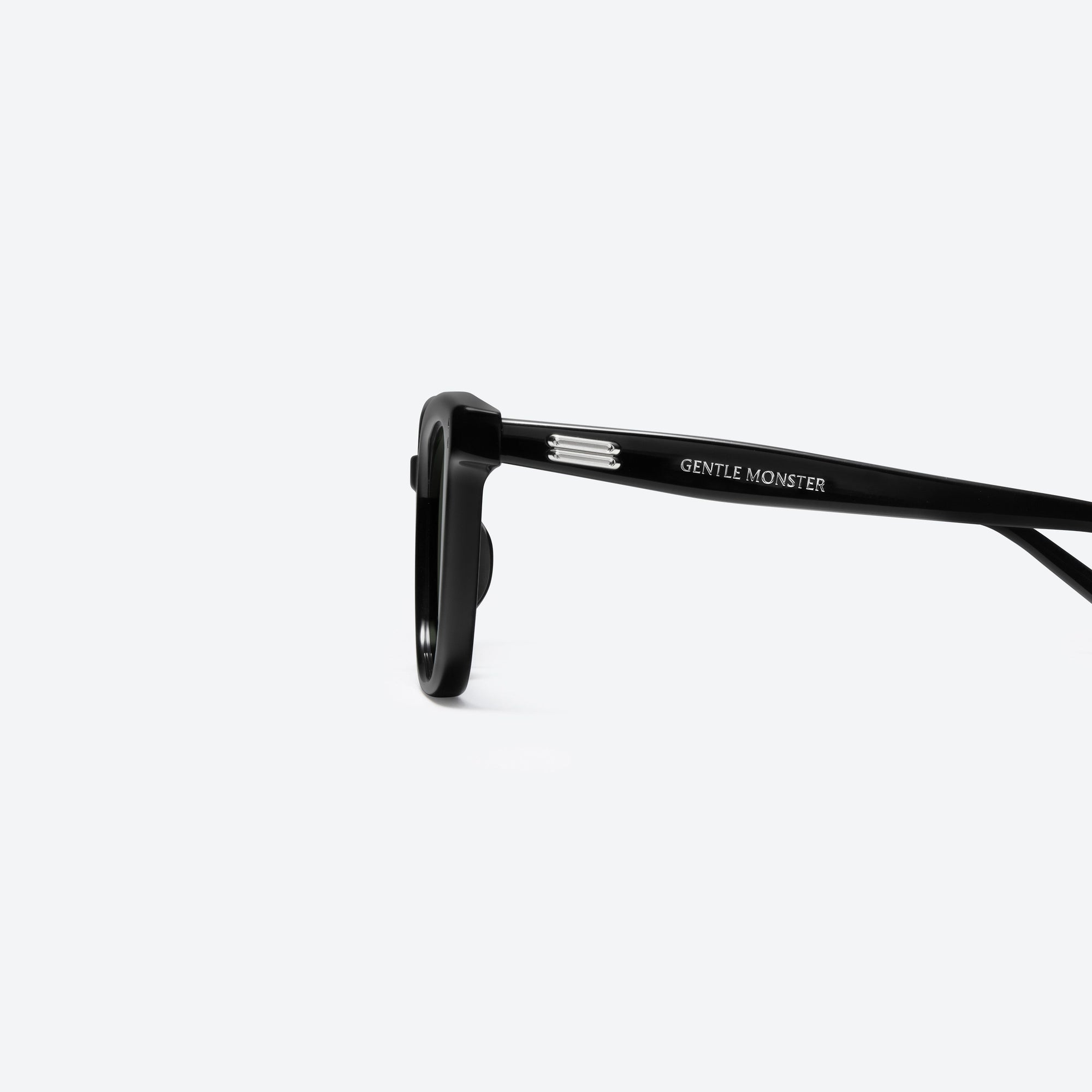 A detailed left view of Gentle Monster Daze 01 Black Acetate framed Square sunglasses.