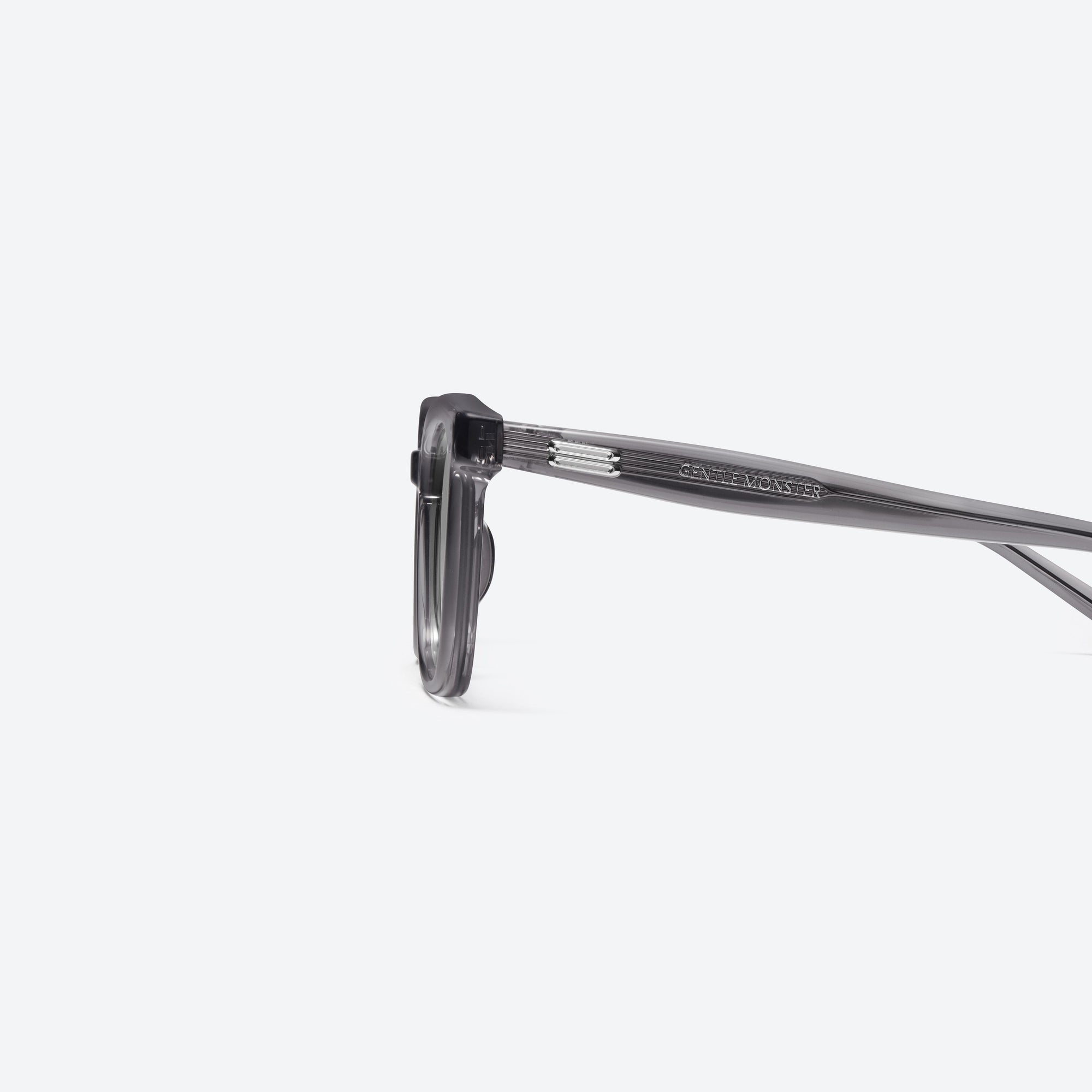 A detailed left view of Gentle Monster Daze GC12 Gray Acetate framed Square sunglasses.