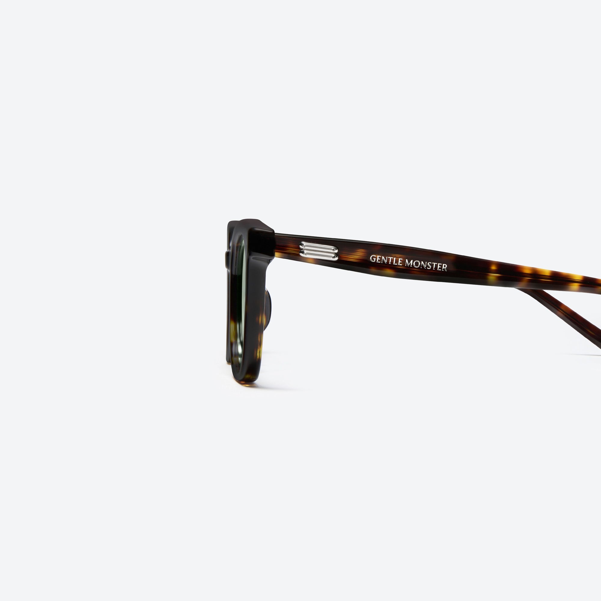 A detailed left view of Gentle Monster Daze T9 Tortoise Acetate framed Square sunglasses.