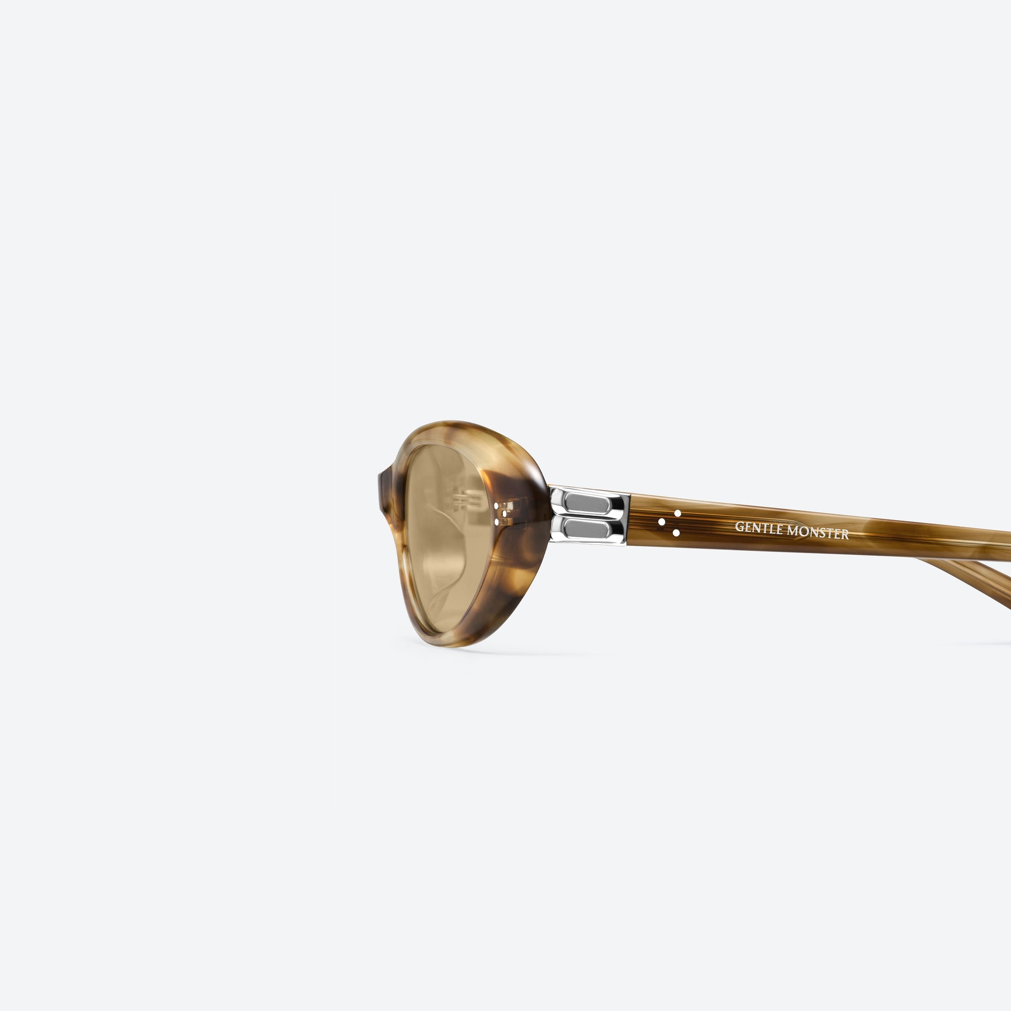 A detailed left view of Gentle Monster Cinnamon T8 Tortoise Acetate framed Oval sunglasses.