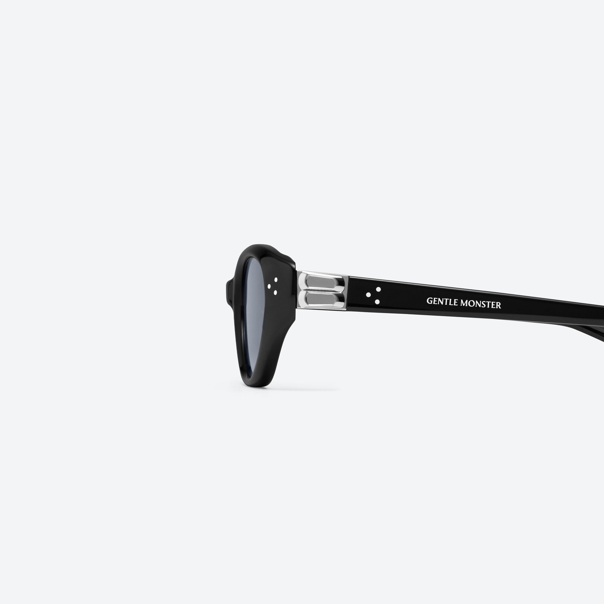 A detailed left view of Gentle Monster Vanilla 01(SM) Black Acetate framed Cat-eye sunglasses.