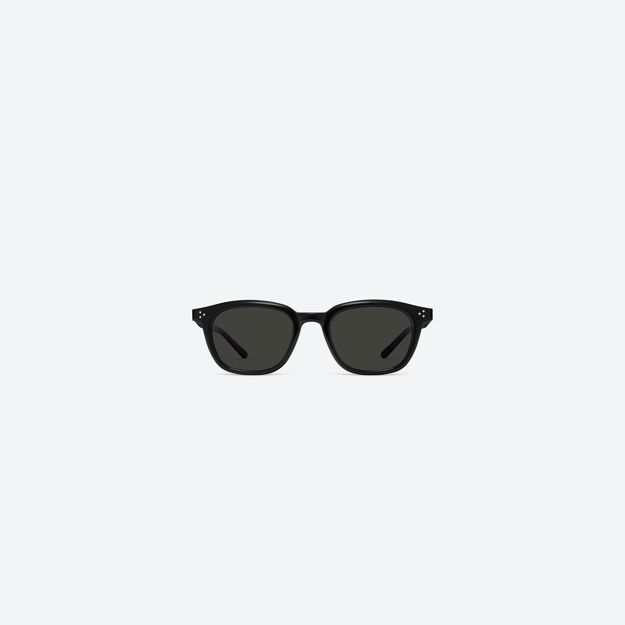 A front view of Gentle Monster Noho 01 Black Acetate framed Round sunglasses.