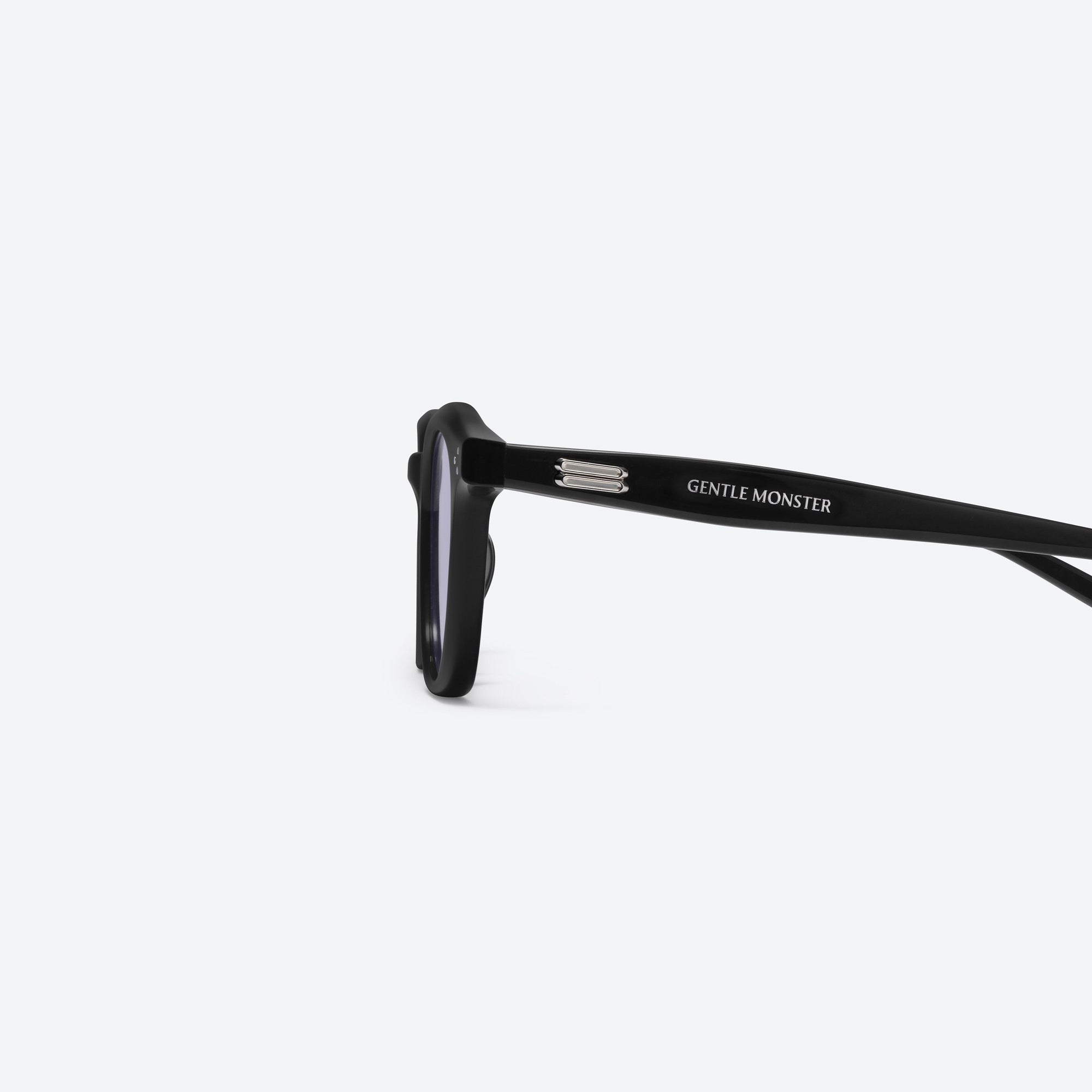 A detailed left view of Gentle Monster Noho 01(V) Black Acetate framed Round sunglasses.